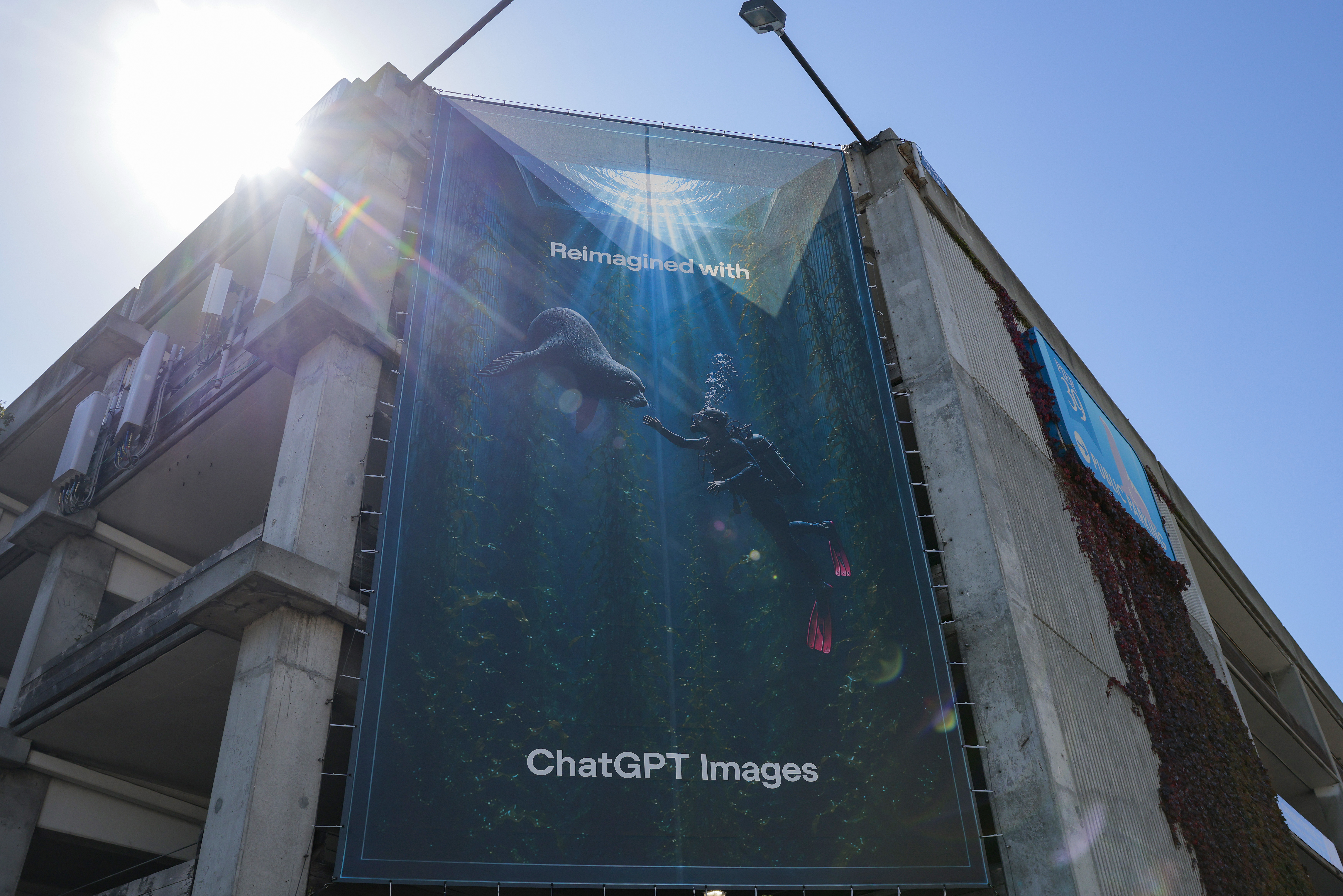 An ad for ChatGPT Images hangs on a parking garage in San Francisco this month. (Heather Diehl/Getty Images)