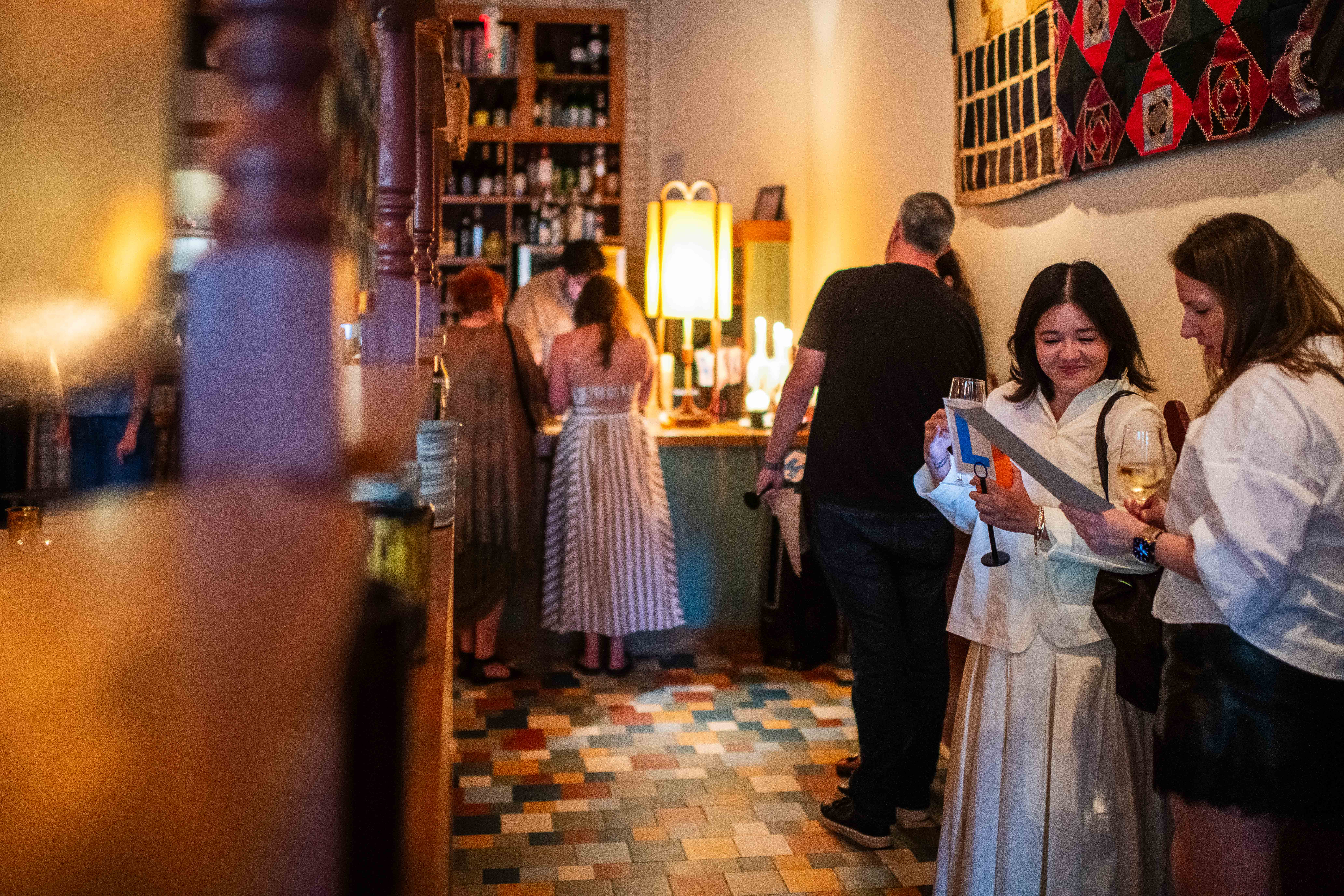The line at Rye Bunny turns into a social gathering as prospective diners sip drinks and wait their turn to order. (Photos by Rey Lopez/For The Washington Post)