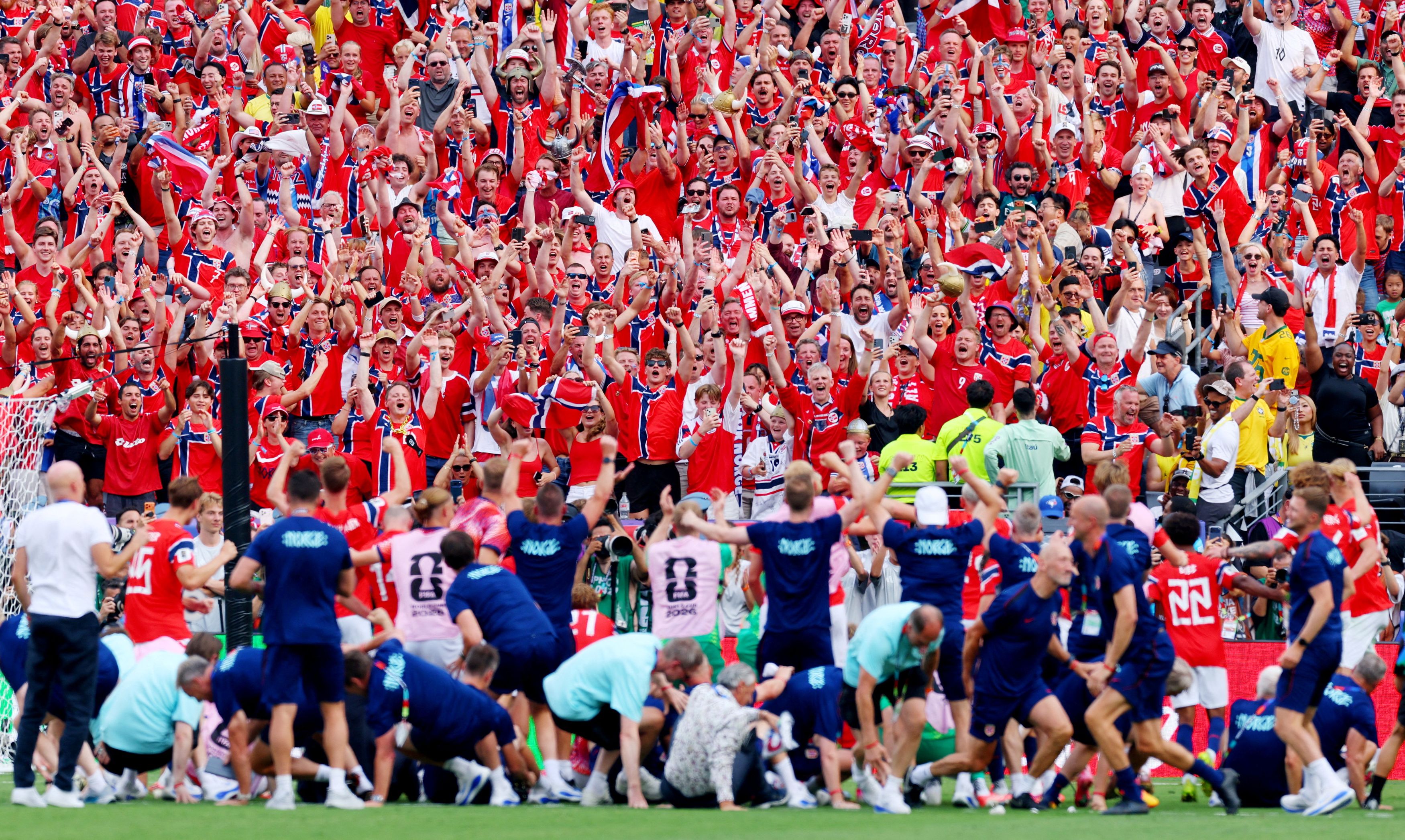 Norway fans rejoice after their team advanced to the quarterfinals for the first time in World Cup history with a victory over Brazil on Sunday in East Rutherford, New Jersey. (Mike Segar/Reuters)