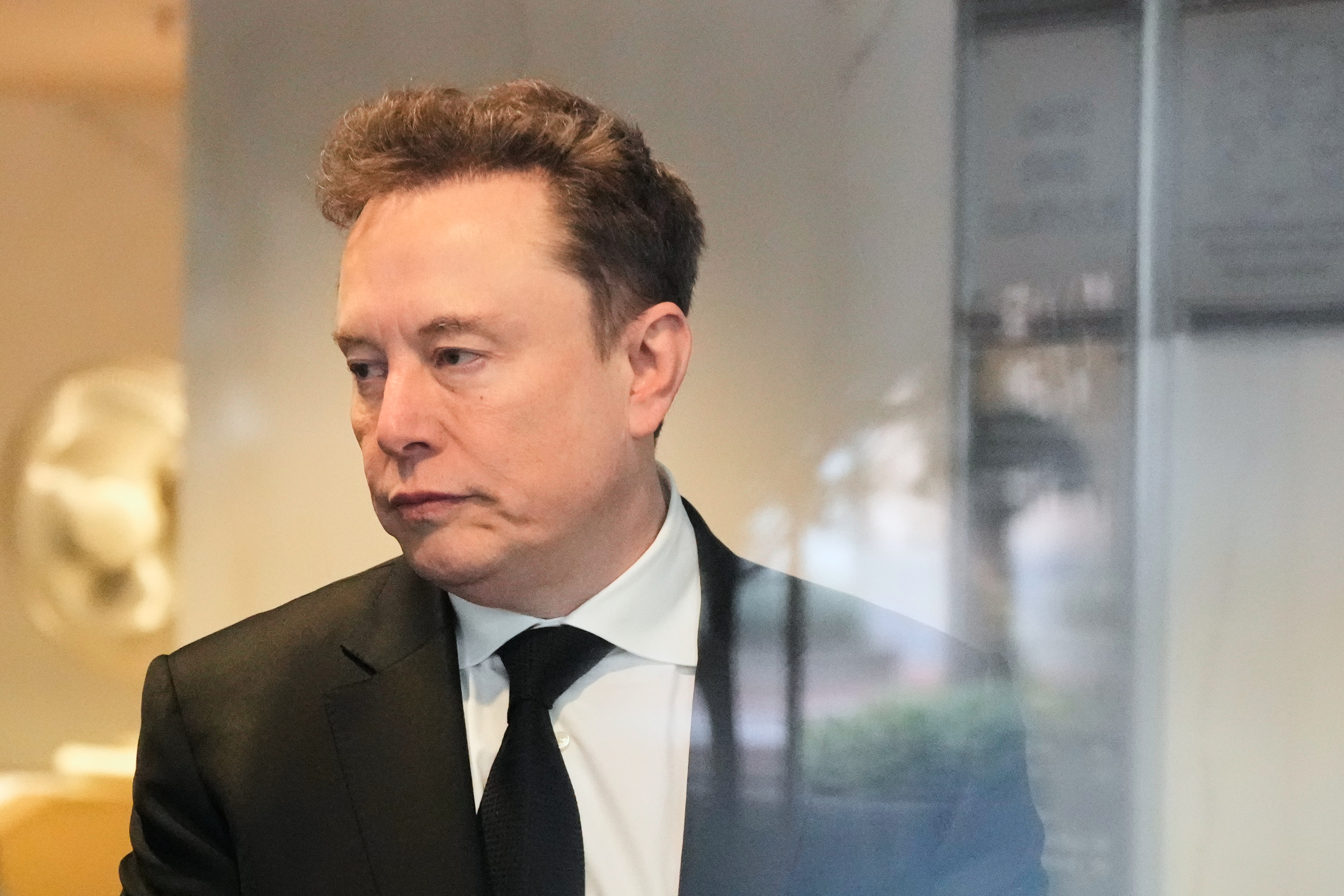 Elon Musk arrives at the U.S. District Court in Oakland, California, on Tuesday. (Godofredo A. Vásquez/AP)