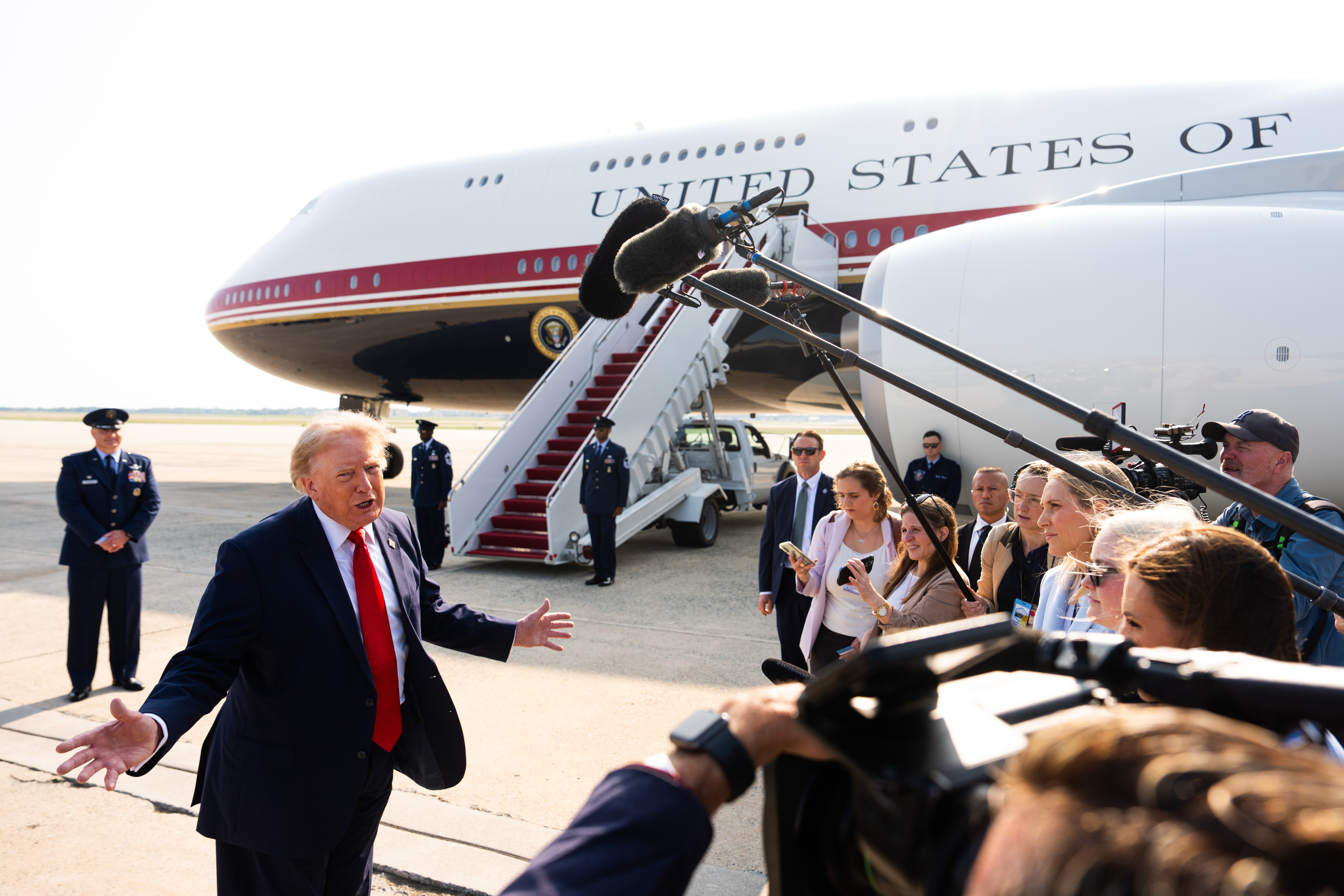 President Donald Trump speaks with reporters before boarding the new Air Force One on Wednesday. (Julia Demaree Nikhinson/AP Photo/Julia Demaree Nikhinson)