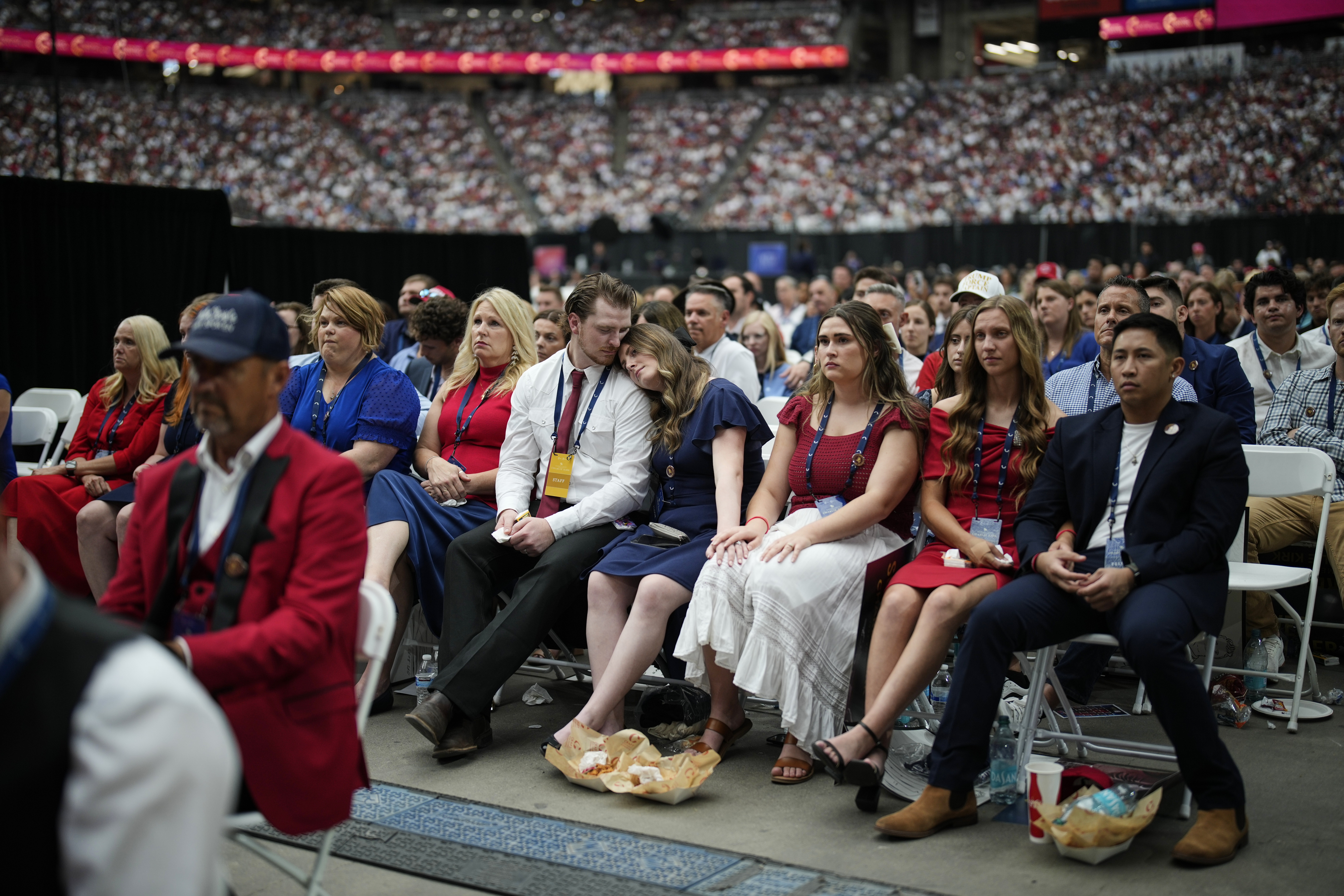 People listen as Erika Kirk speaks at a memorial for her late husband, conservative activist Charlie Kirk, last September in Glendale, Arizona. (John Locher/AP)