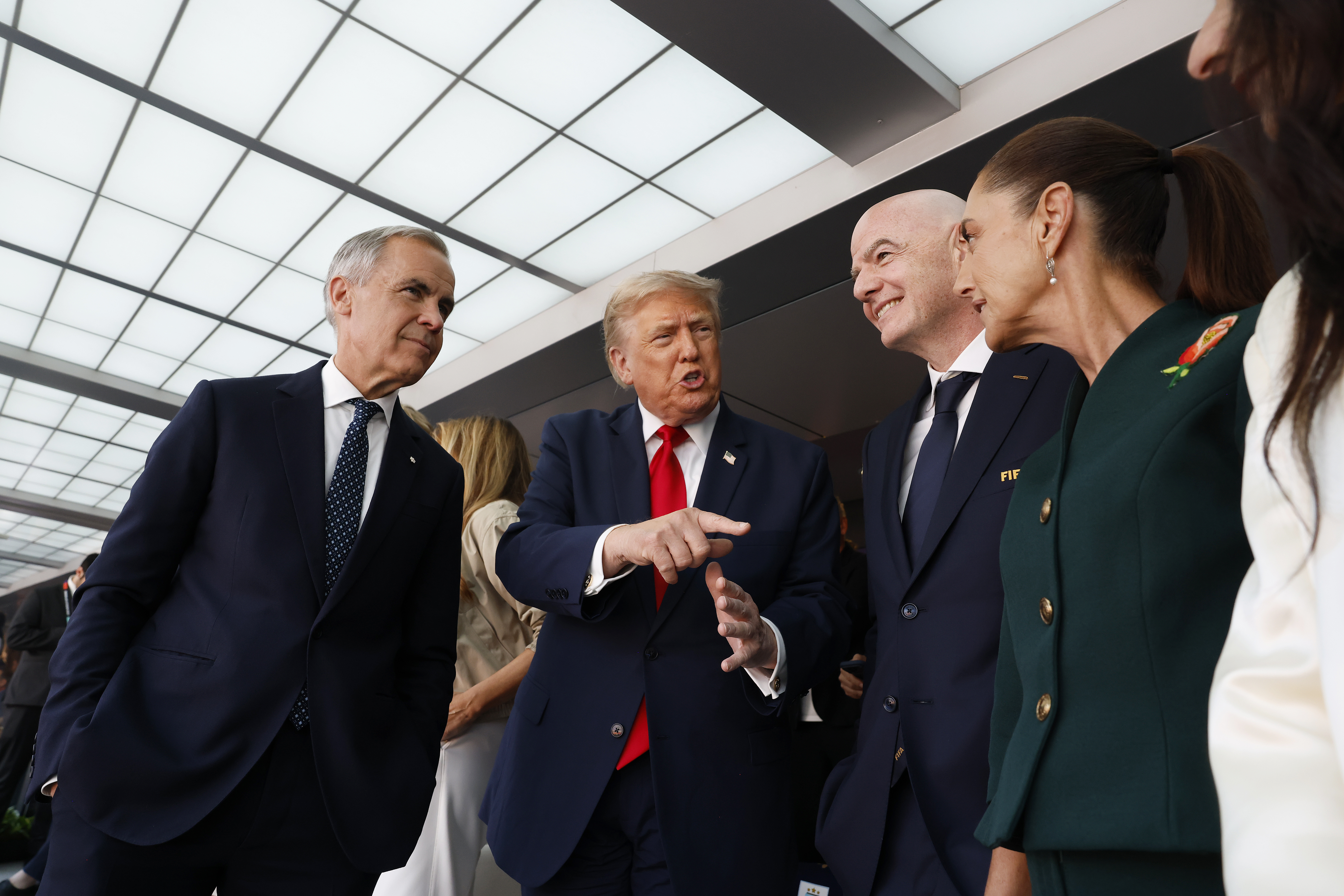 Canadian Prime Minister Mark Carney, left, joined U.S. President Donald Trump at the World Cup final Sunday in East Rutherford, New Jersey. (Eva Marie Uzcategui/FIFA/Getty Images)