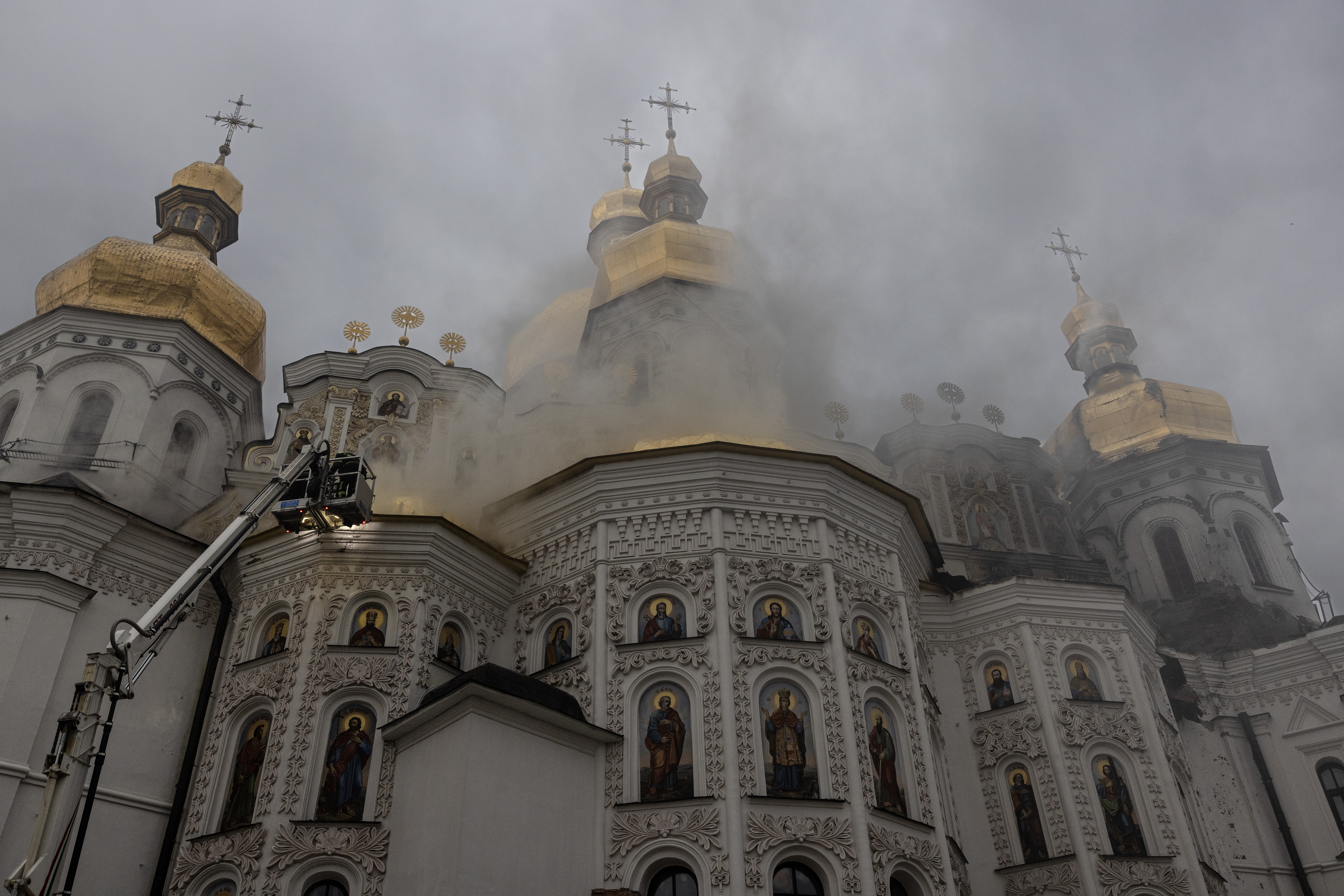 Firefighters check the roof of the Assumption Cathedral of the Kyiv Pechersk Lavra after a large-scale attack overnight. (Paula Bronstein/Getty Images)