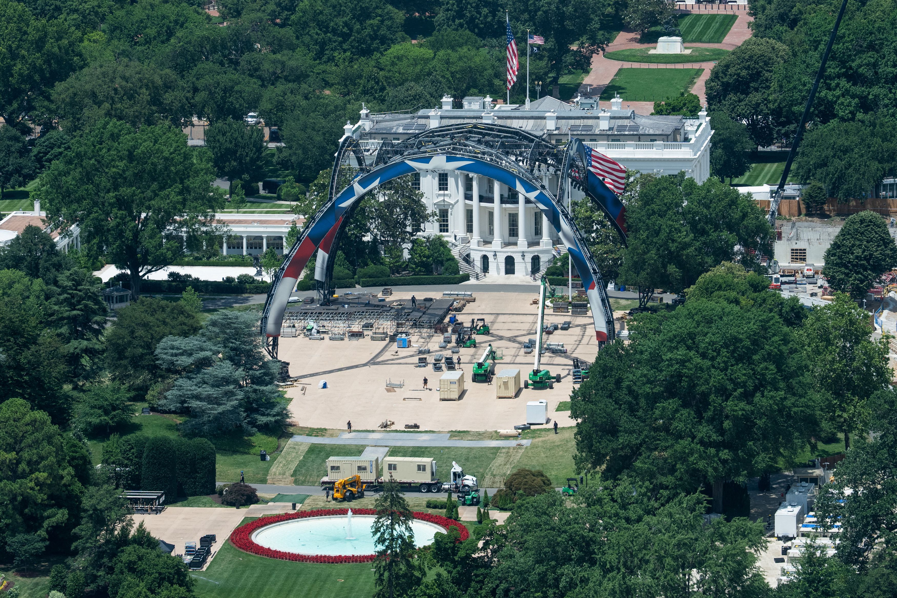 Crews take down the UFC fighting venue on the South Lawn of the White House on June 19. (Aaron Schwartz/Reuters)