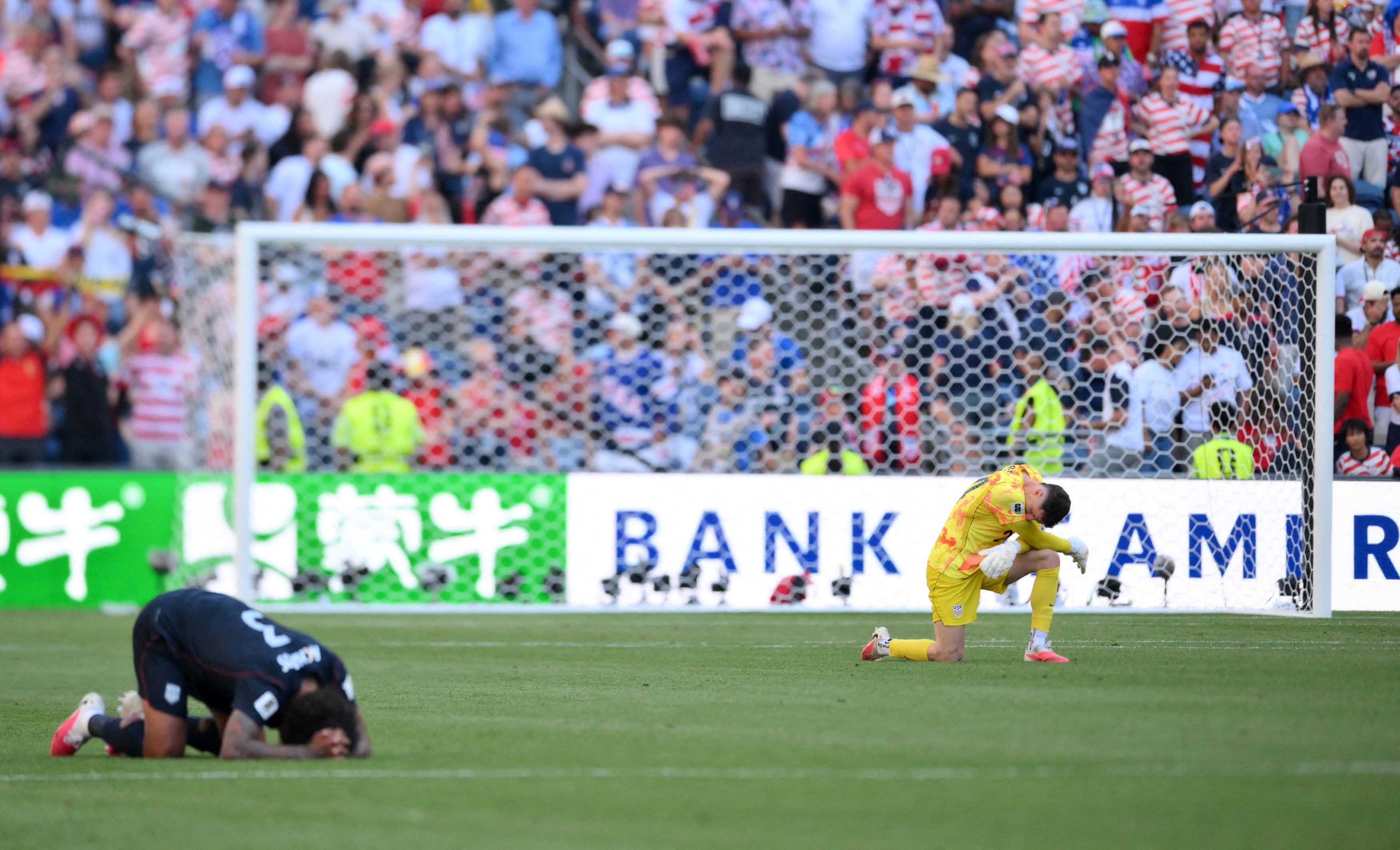 U.S. goalkeeper Matt Freese, right, looks dejected Monday after the match against Belgium. (Steven Bisig/IMAGN IMAGES via Reuters)