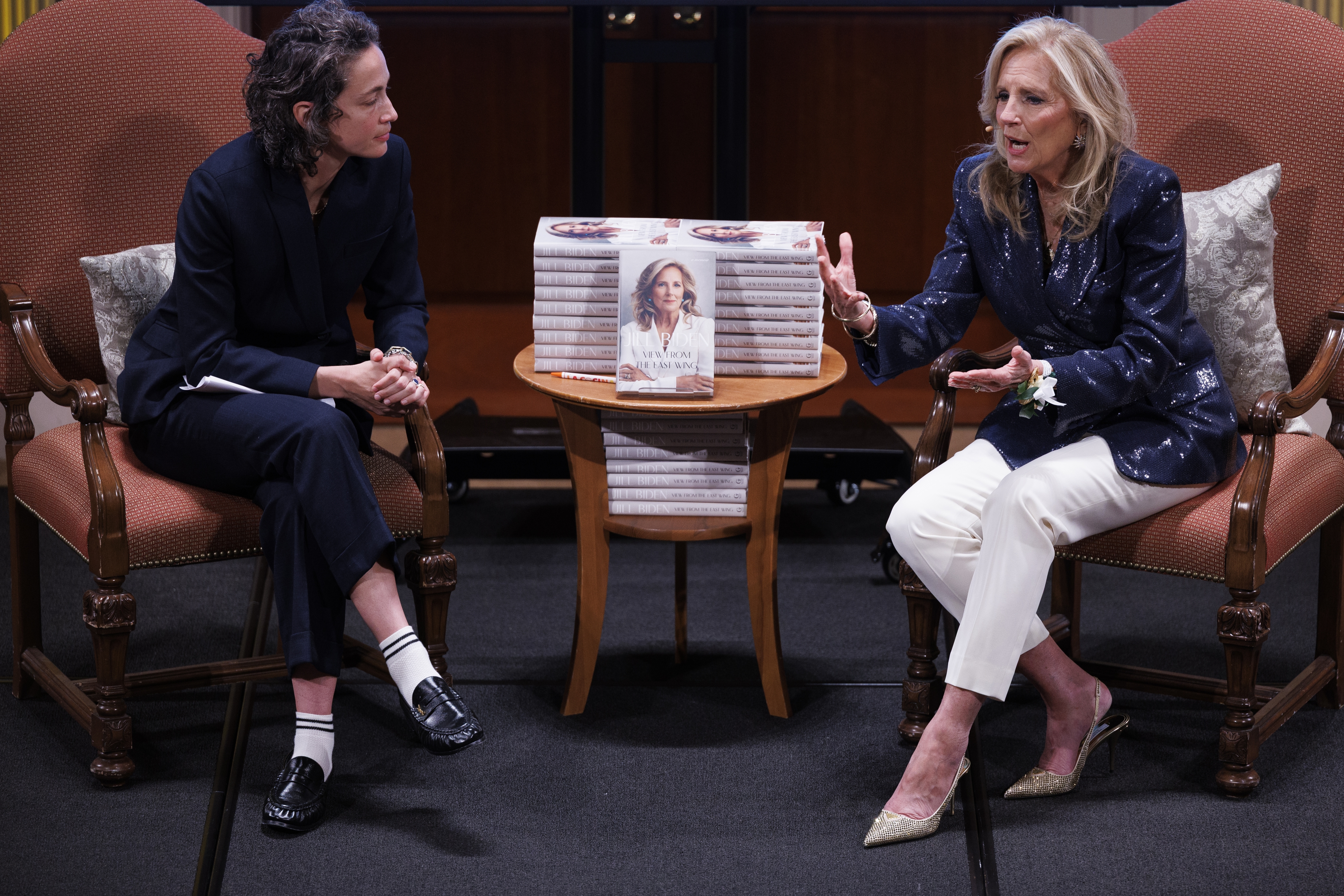 Former first lady Jill Biden, right, speaks with journalist Paola Ramos on Wednesday in D.C. as part of a promotional tour for her new memoir. (Tom Brenner/Getty Images)