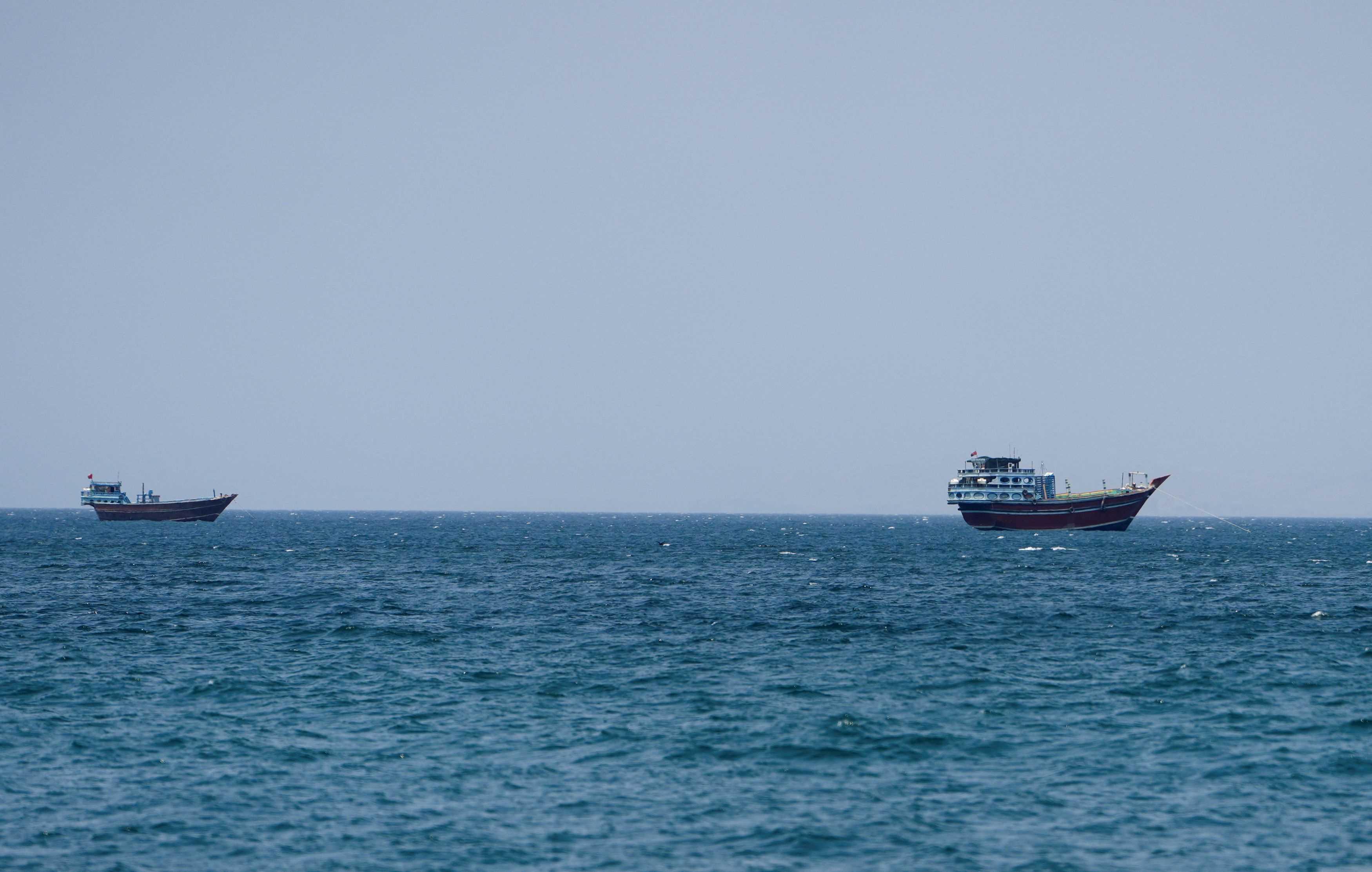 Vessels in the Strait of Hormuz, as seen from Musandam, Oman, on Sunday. (Reuters)