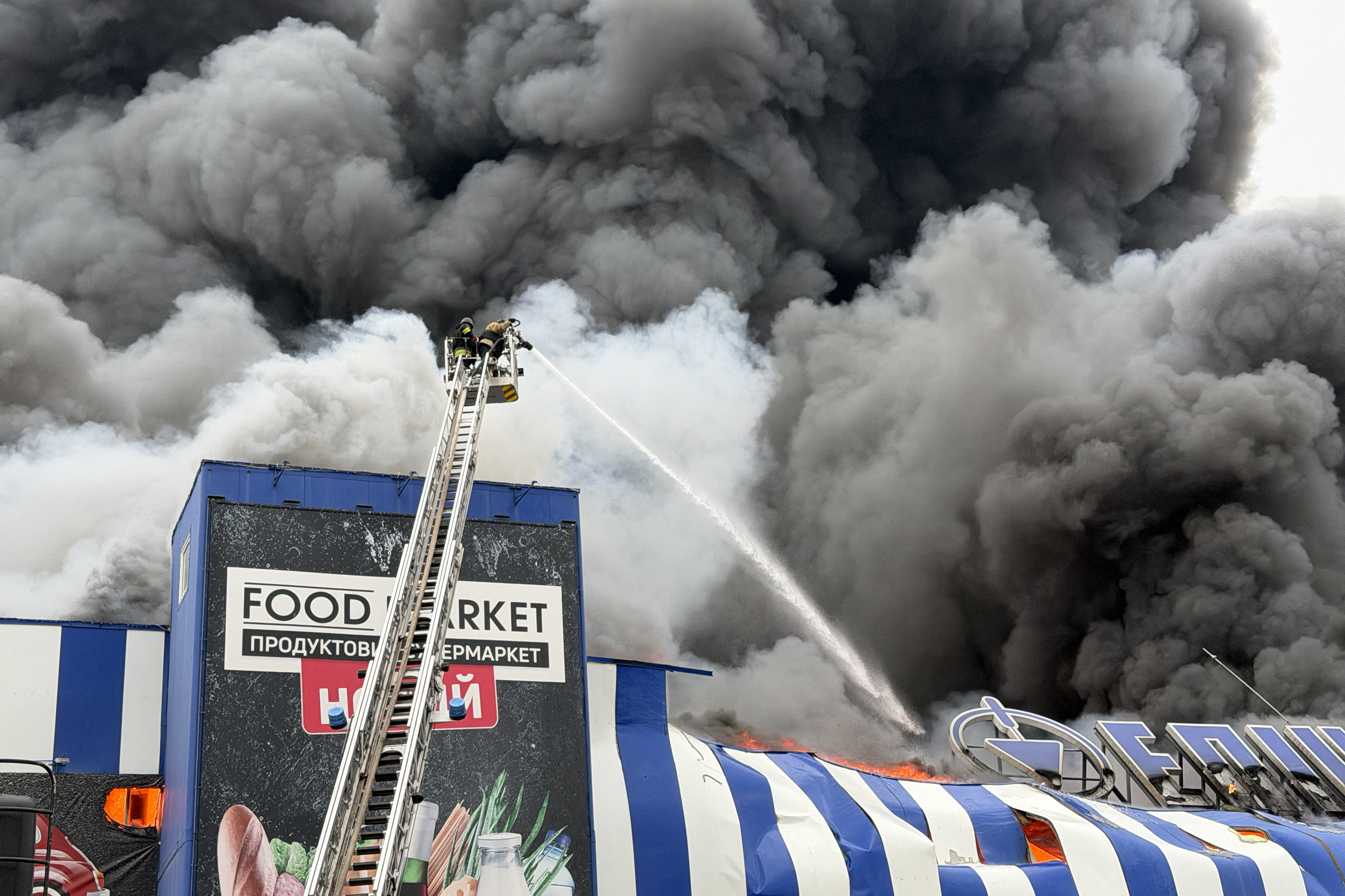 A fire at a mall after an airstrike on Zaporizhzhia, Ukraine, on Friday. (Darya Nazarova/AFP/Getty Images)