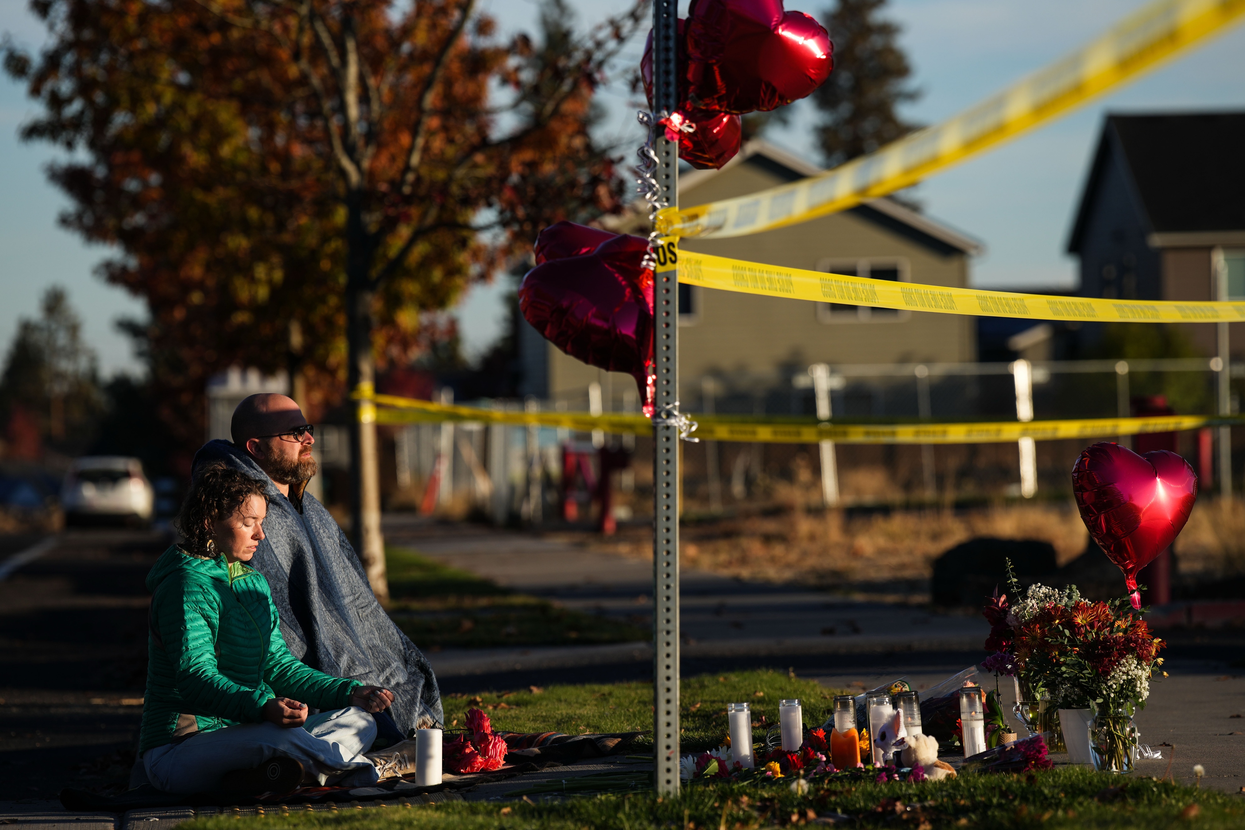 Locals mourn at a memorial at Silver Rail Elementary School in Bend, Oregon, on Friday. (Cody Rheault/For The Washington Post)
