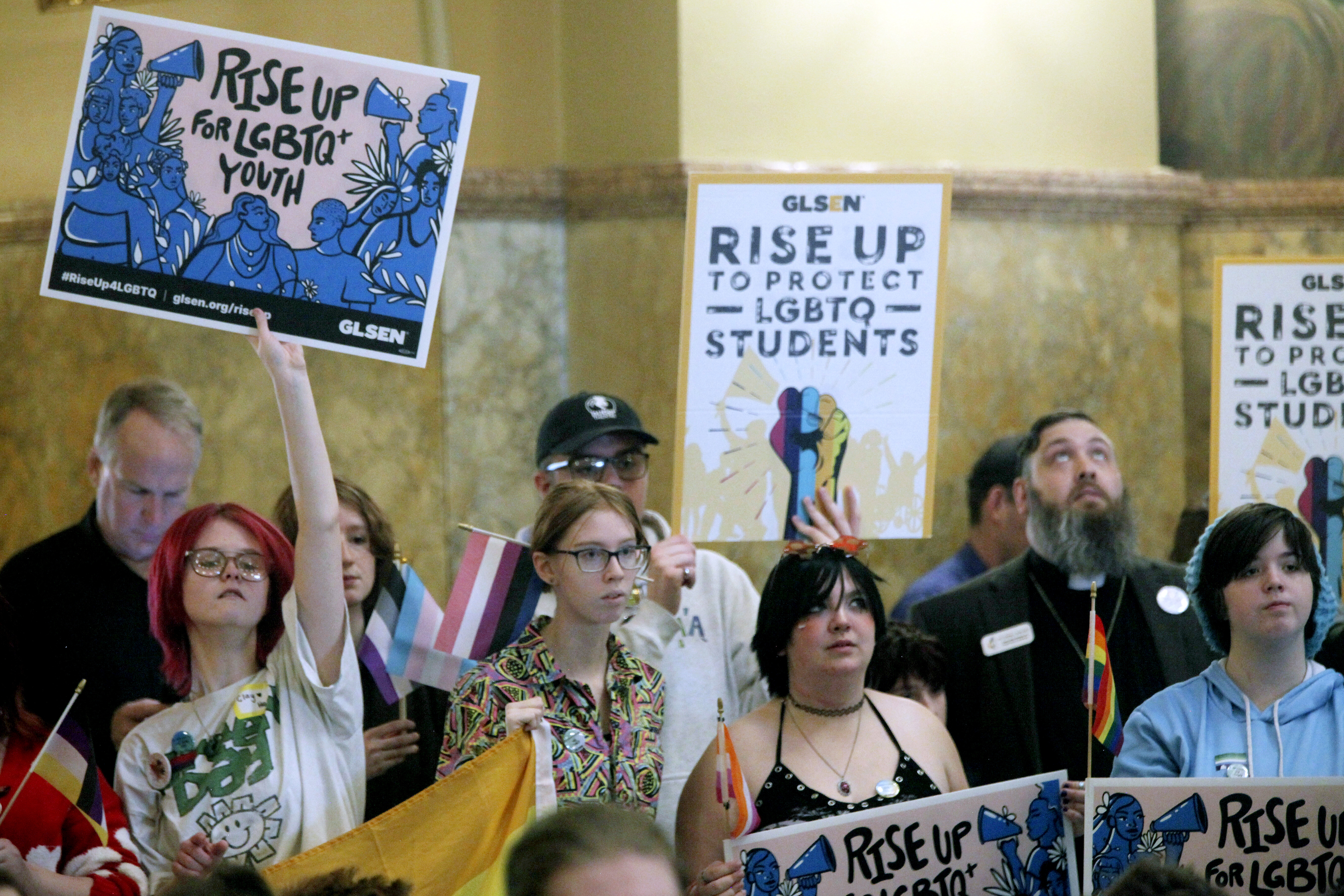 High school students, family members and advocates rally for transgender rights in 2024 at the Kansas Capitol in Topeka. (John Hanna/AP)
