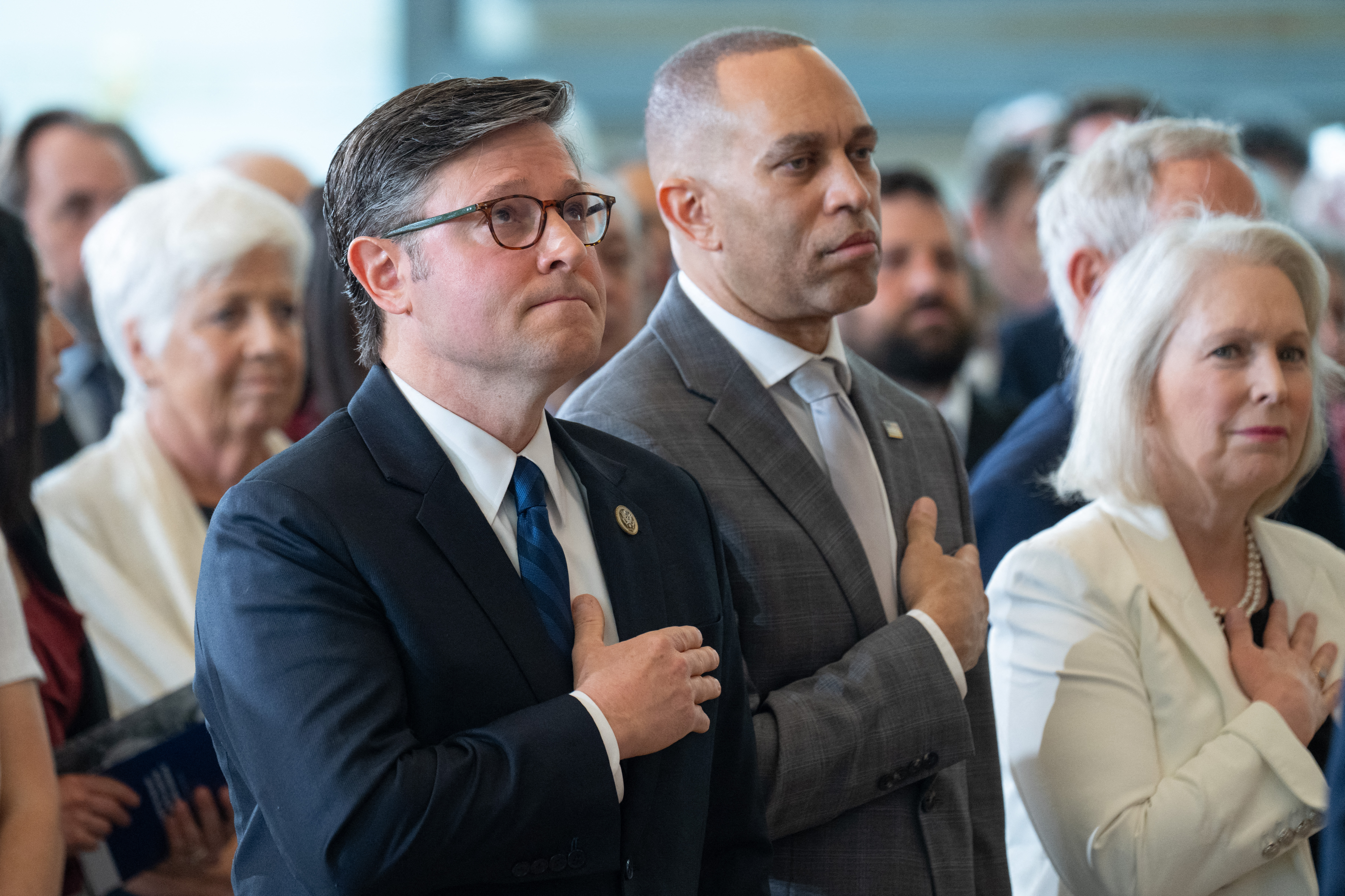 House Speaker Mike Johnson (R-Louisiana) and House Minority Leader Hakeem Jeffries (D-New York) at an event in Washington on April 14. (Saul Loeb/AFP/Getty Images)