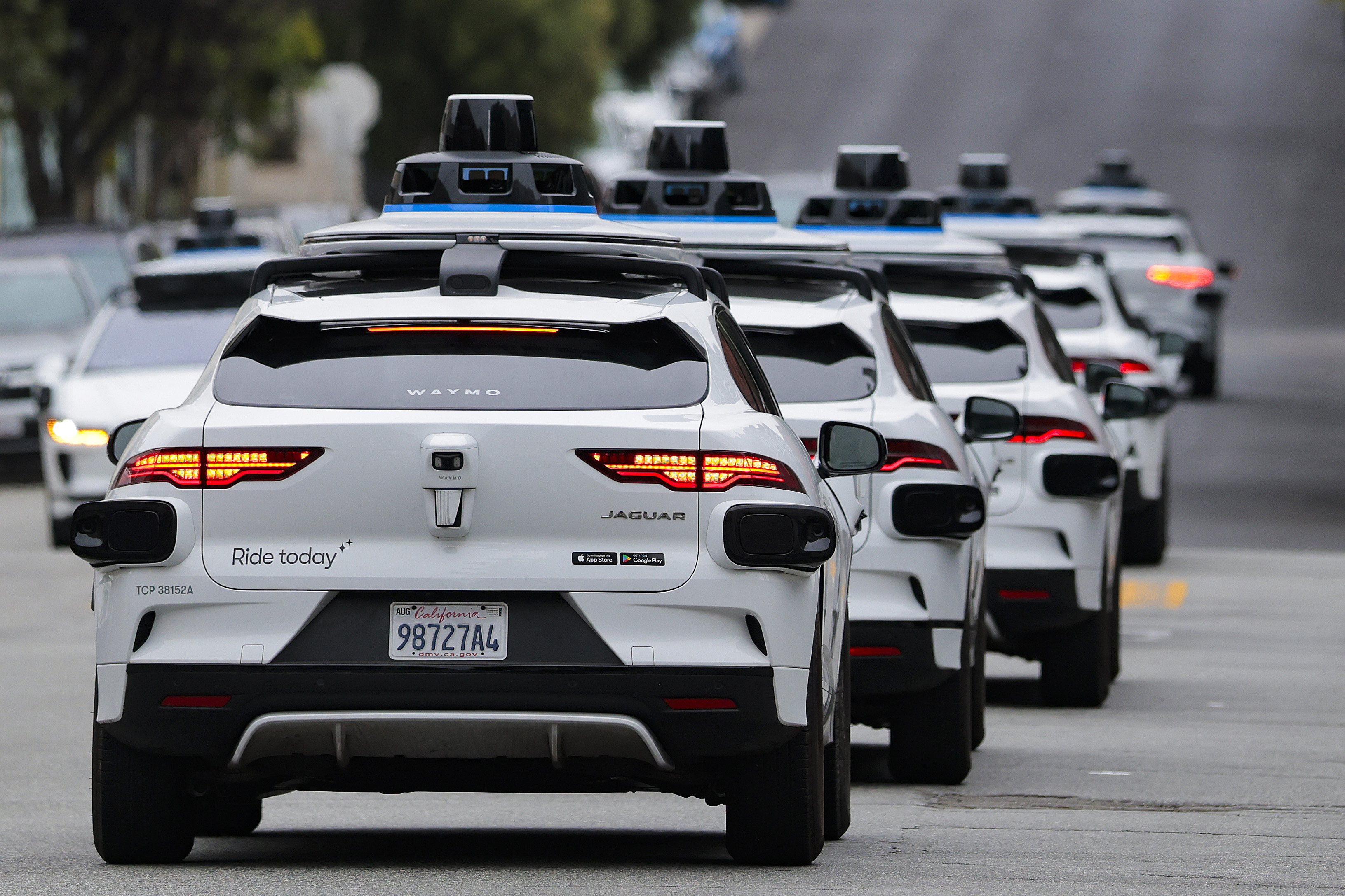 A line of Waymo robotaxis in San Francisco. The D.C. Council is weighing a bill that would legalize the commercial operation of autonomous vehicles in the District. (Heather Diehl/Getty Images)