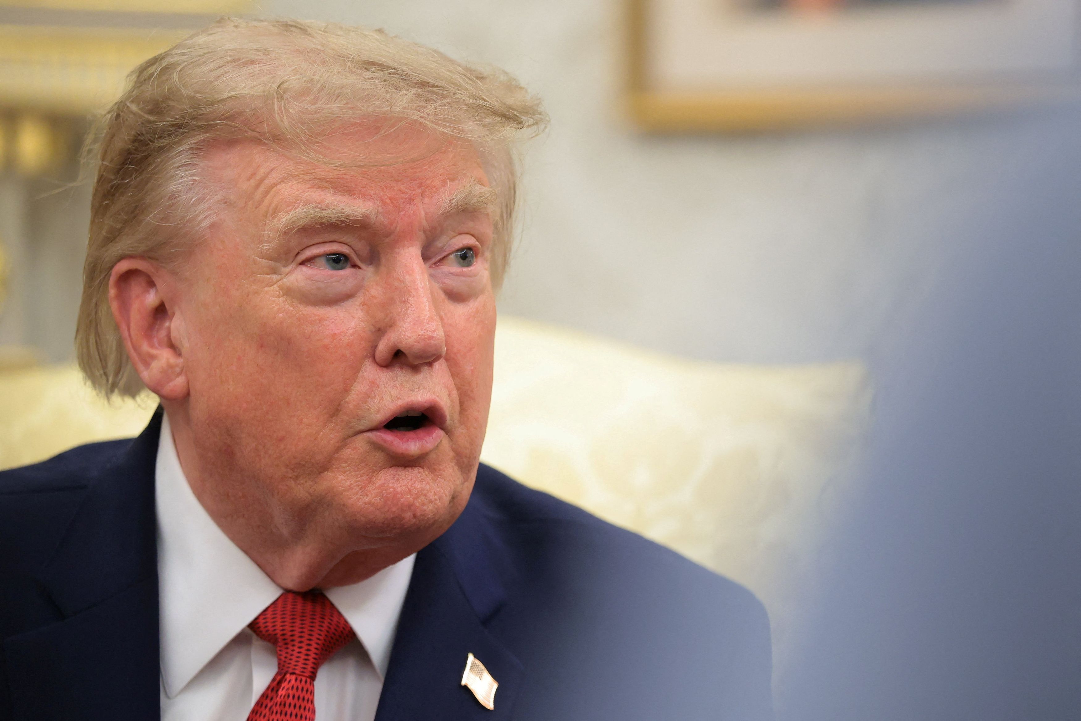 President Donald Trump told CNN correspondent Kristen Holmes in the Oval Office: “Be quiet, be quiet, be quiet. You’re a fake reporter, and you report fake news.” (Kylie Cooper/Reuters)