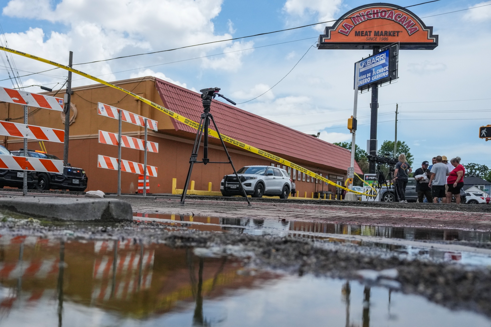 Police tape cordons off the street in Houston where the fatal shooting took place. (Jacob Lujan/Houston Chronicle/AP)