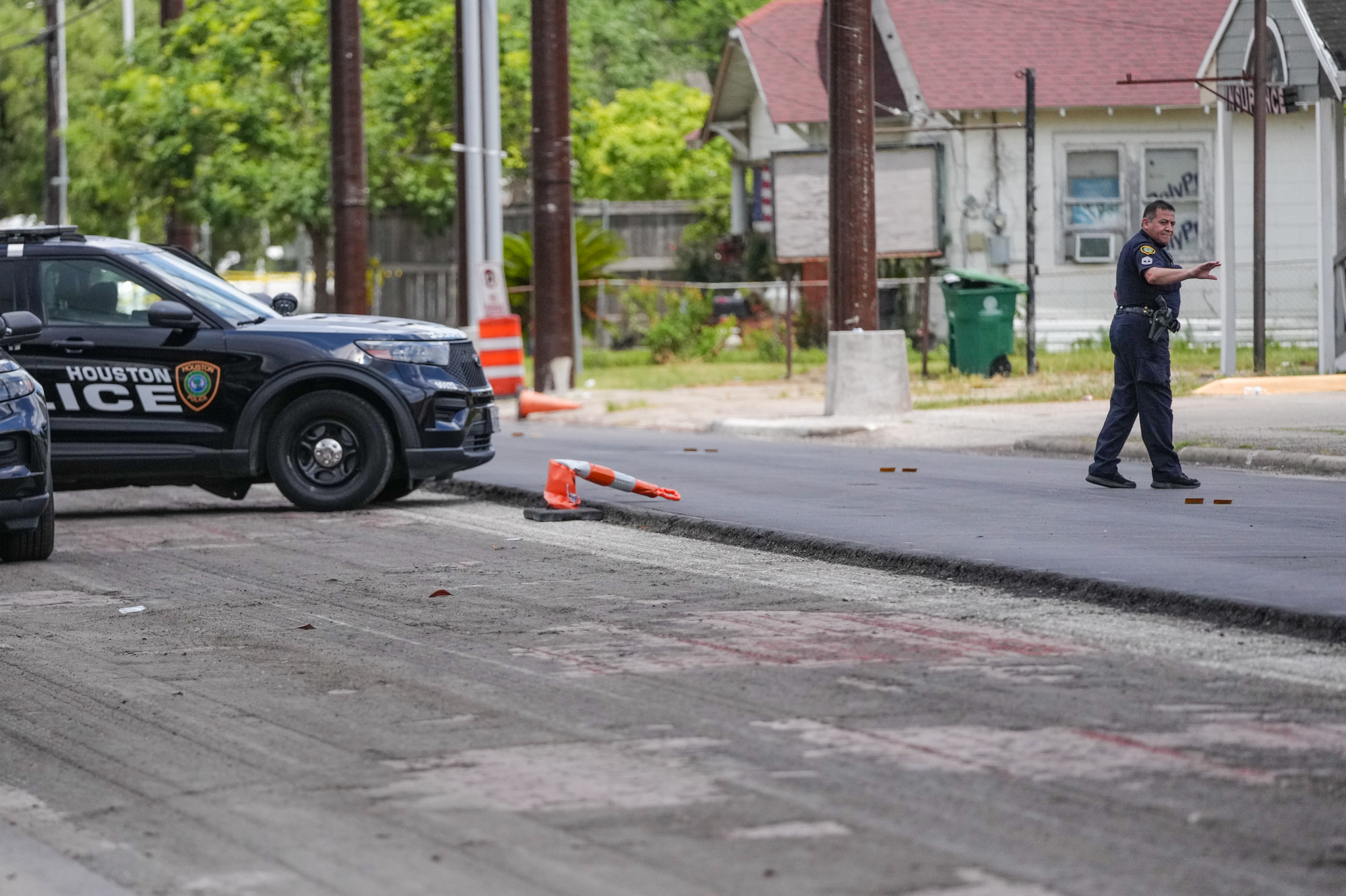 Houston police officers on the scene of Tuesday’s shooting. (Jacob Lujan/Houston Chronicle/AP)