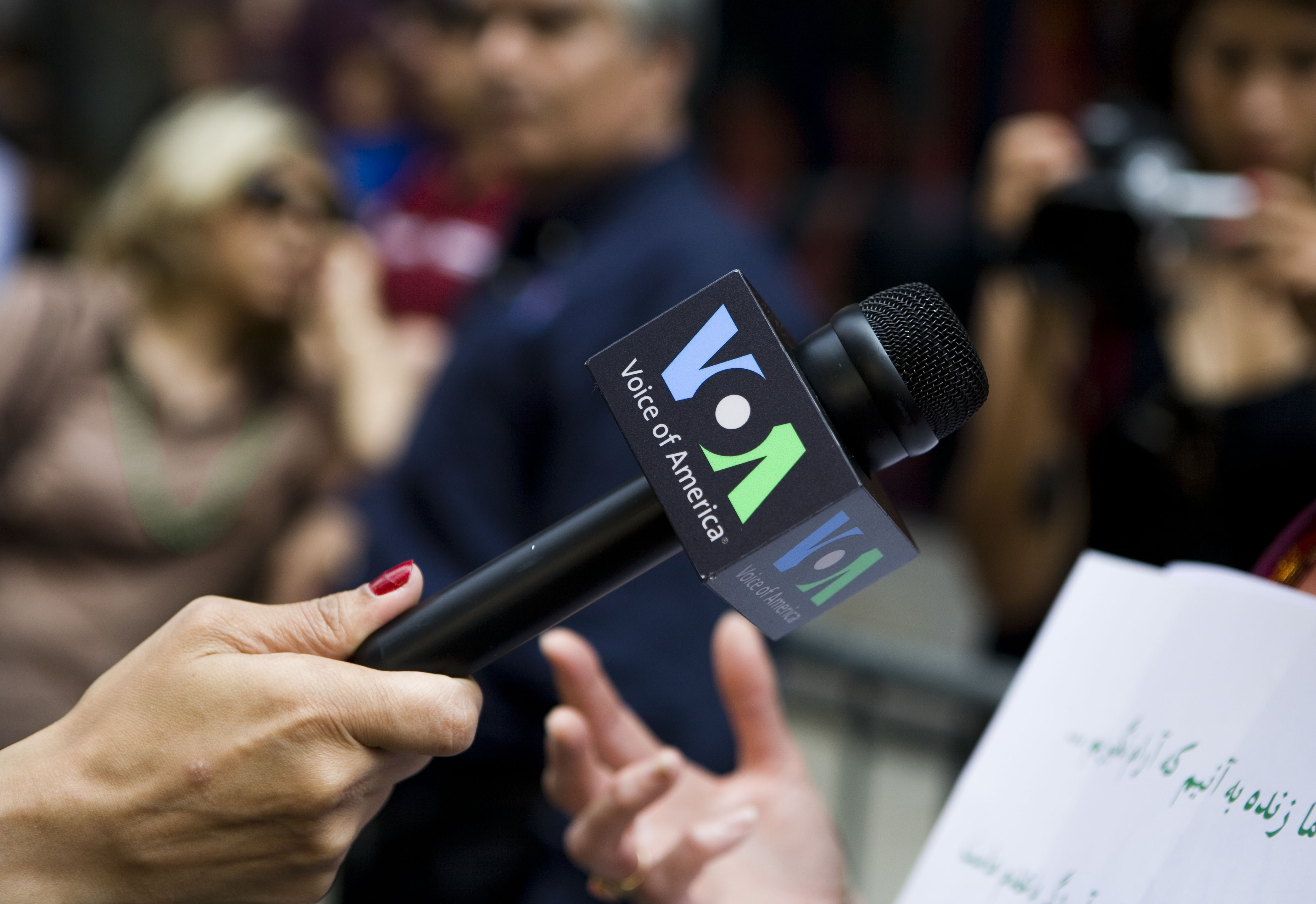 A reporter from the Voice of America during a rally by Iranian dissidents in New York City. (Ramin Talaie/Corbis/Getty Images)