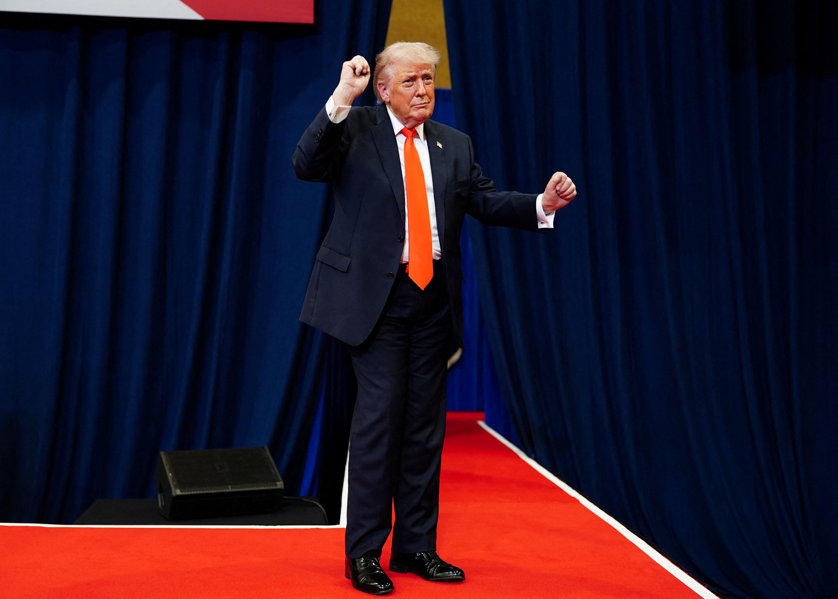 President Donald Trump dances as he departs an event Friday at the Villages Charter School in the Villages, Florida. (Nathan Howard/Reuters)