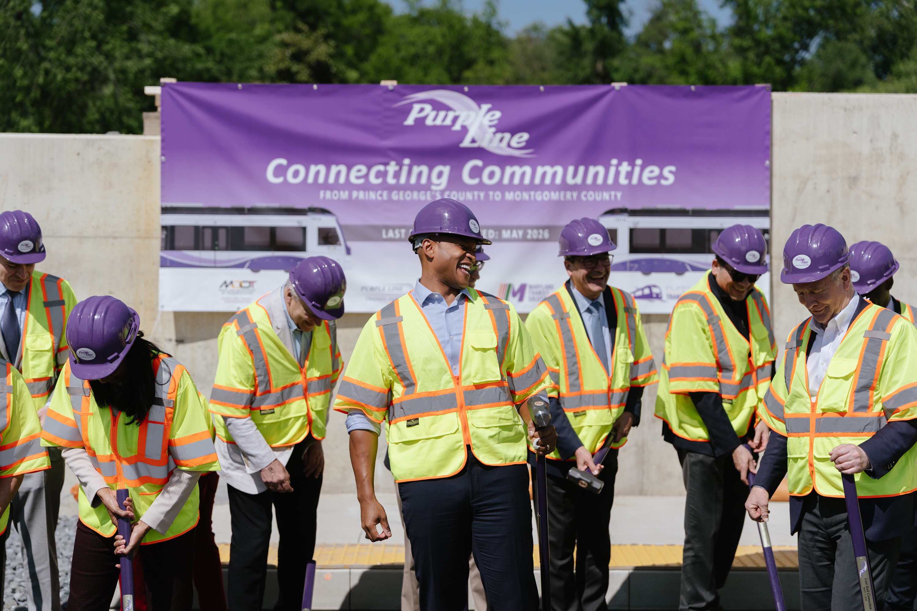 Gov. Wes Moore (D) and other Maryland officials gather to celebrate the completion of the Purple Line in Silver Spring on Thursday. (Jordan Tovin/For the Washington Post)