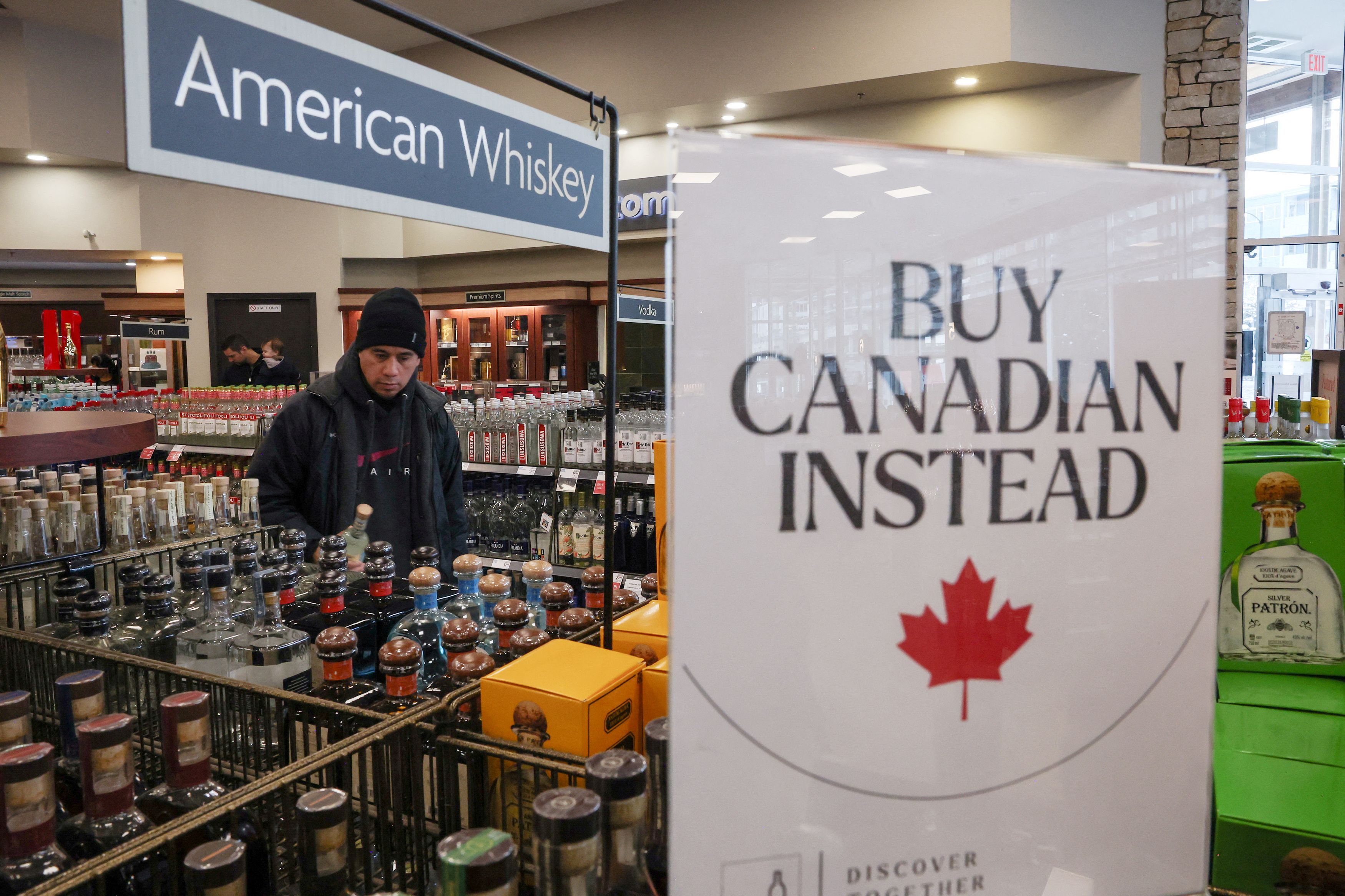 A sign at a liquor store in Vancouver, British Columbia, urges customers to purchase Canadian products in 2025. (Chris Helgren/Reuters)