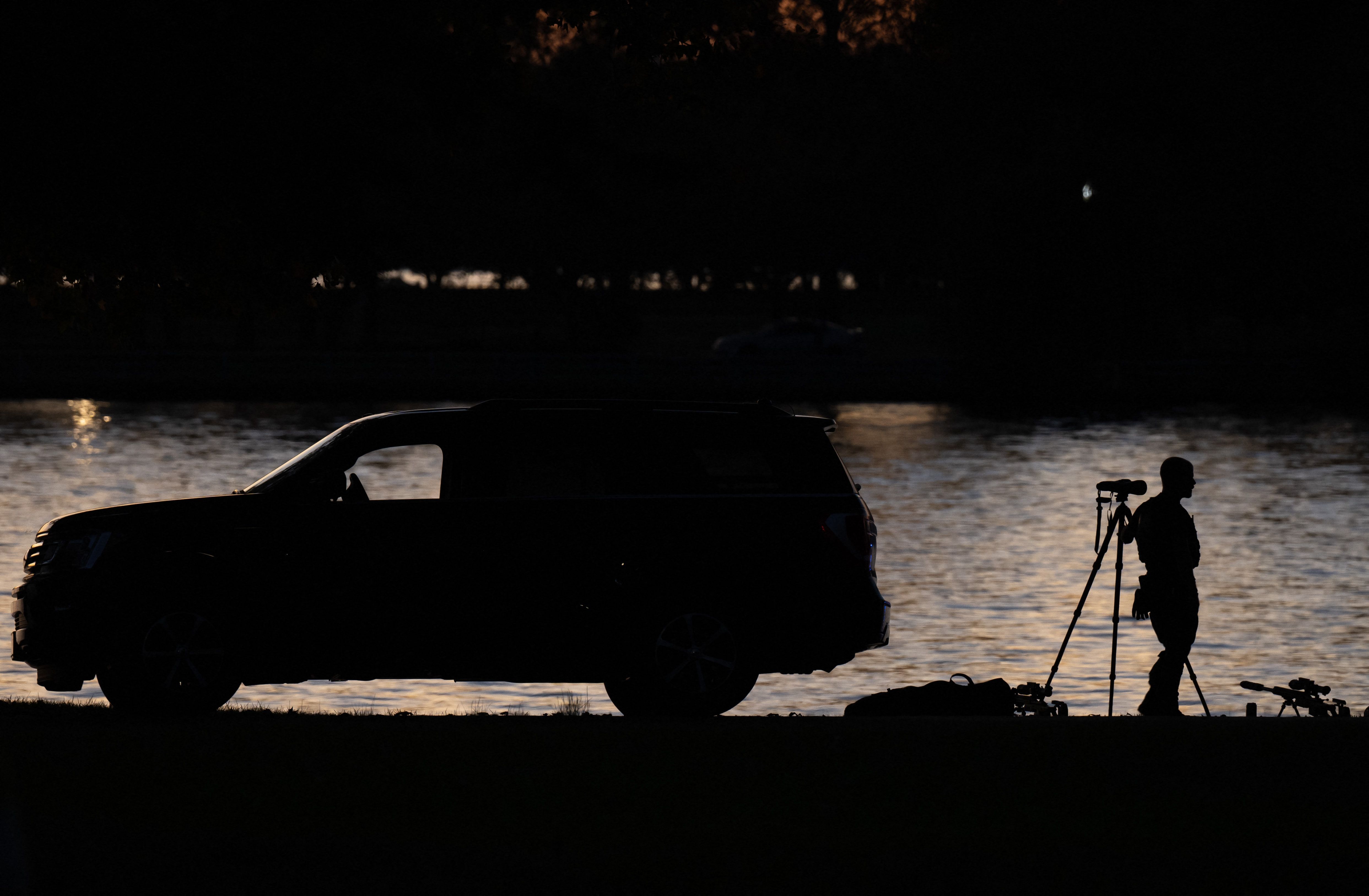 Secret Service agents stand watch during a visit by President Joe Biden in 2023 to Fort McNair in Washington. (Saul Loeb/AFP/Getty Images)