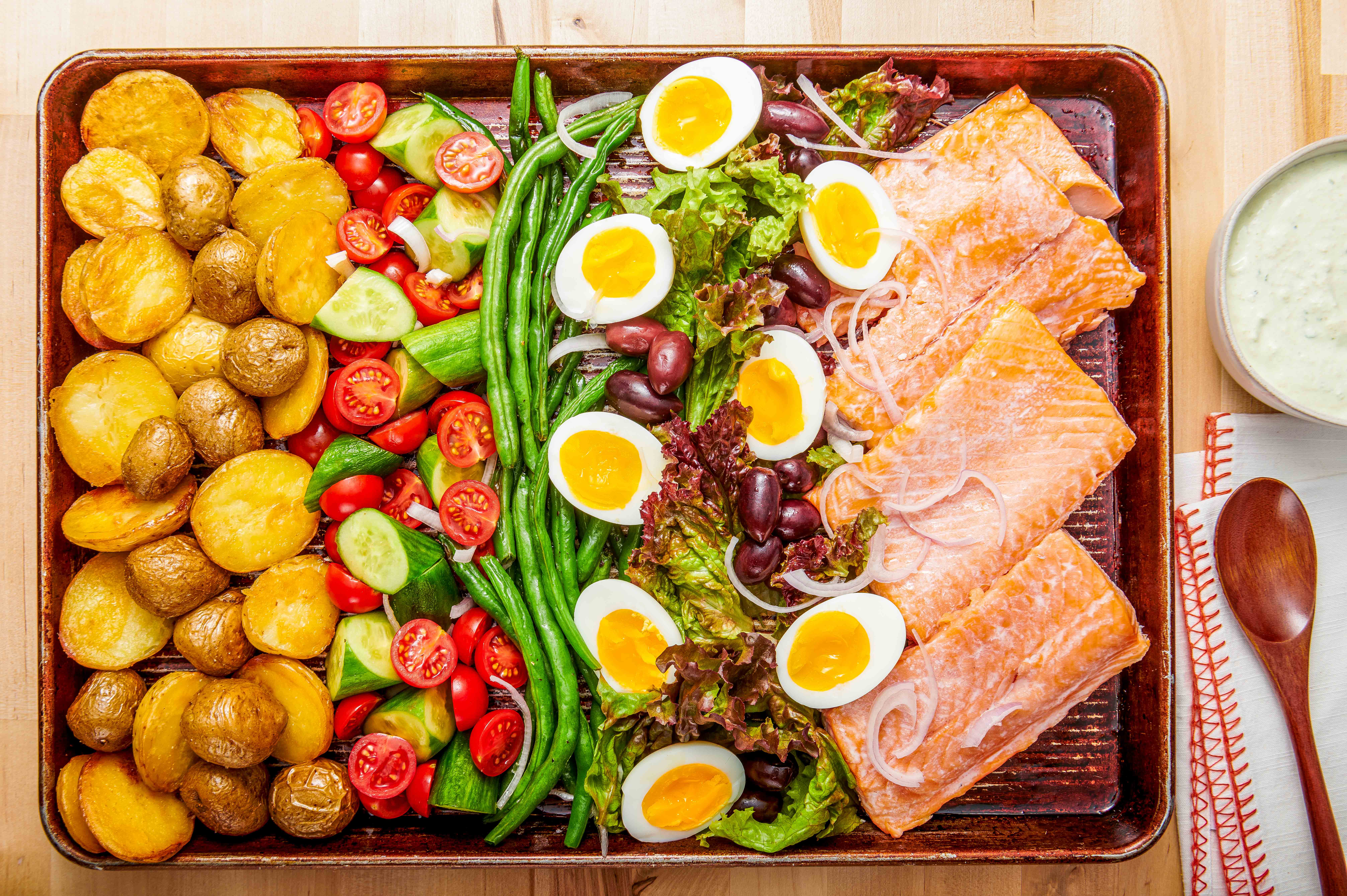 A roast salmon niçoise with creamy olive dressing. (Rey Lopez/For The Washington Post; food styling by Carolyn Robb)