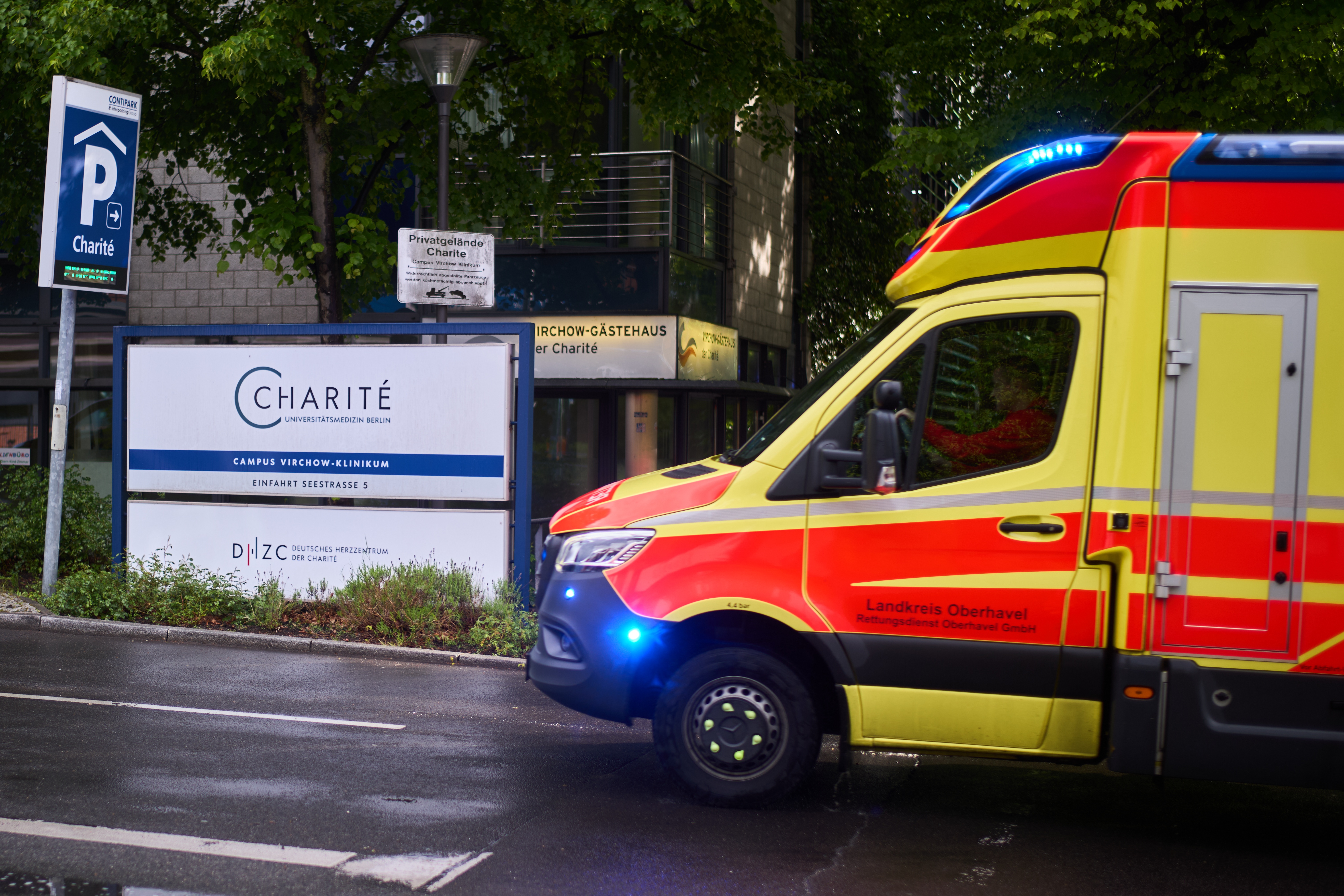 An ambulance arrives Wednesday at a hospital in Berlin where a U.S. national who tested positive for Ebola in Congo is in a special isolation ward. (Markus Schreiber/AP)