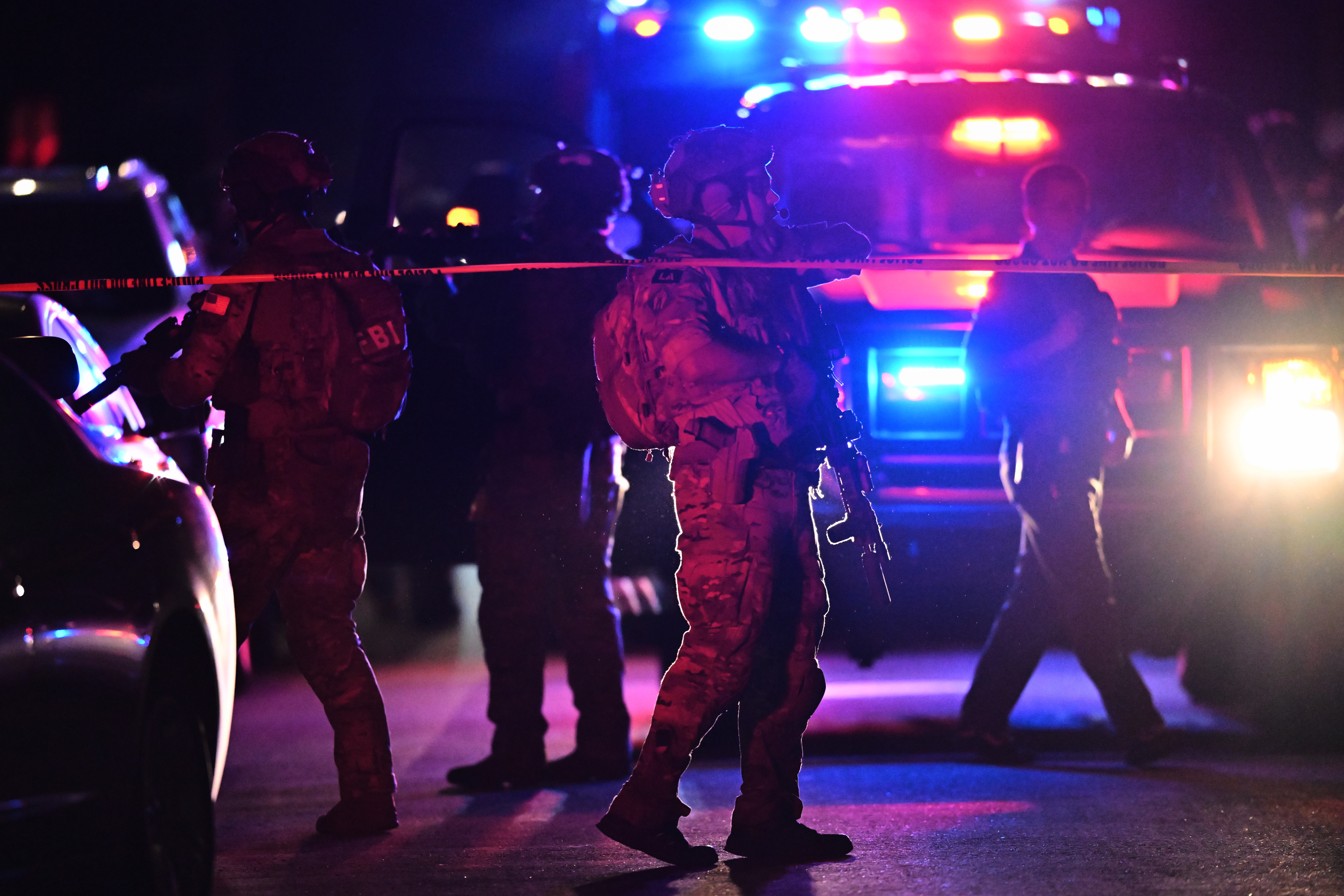 Law enforcement officials respond to an address connected to Cole Tomas Allen, the suspect in the shooting at the White House correspondents' dinner, on Saturday in Torrance, California. (William Lang/AP)