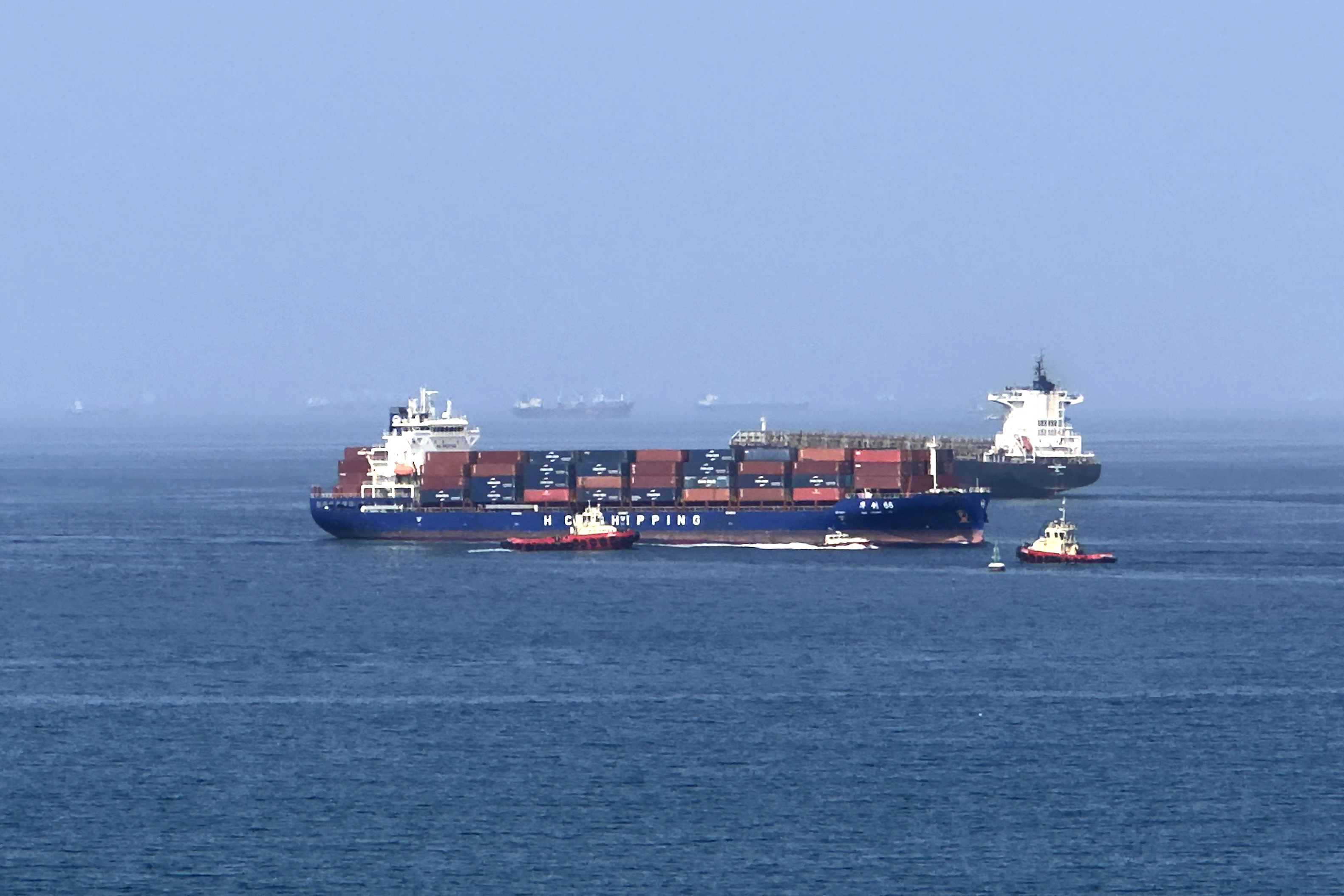 A cargo ship is seen off the coast of the United Arab Emirates, along the Gulf of Oman, on Sunday. (AFP/Getty Images)
