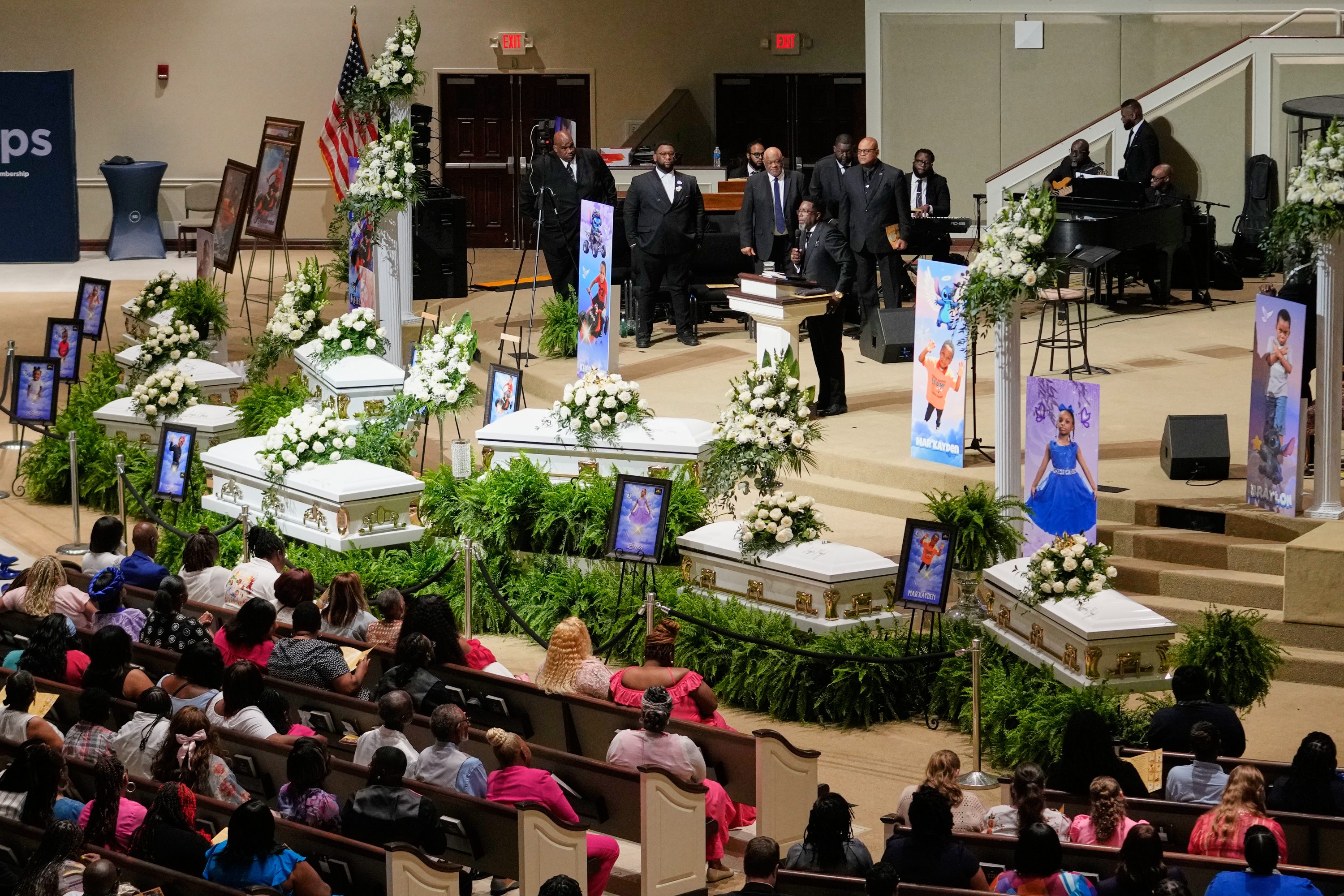 People listen during the funeral for the eight children who were killed last month, at the Summer Grove Baptist Church in Shreveport, La. (Gerald Herbert/AP)