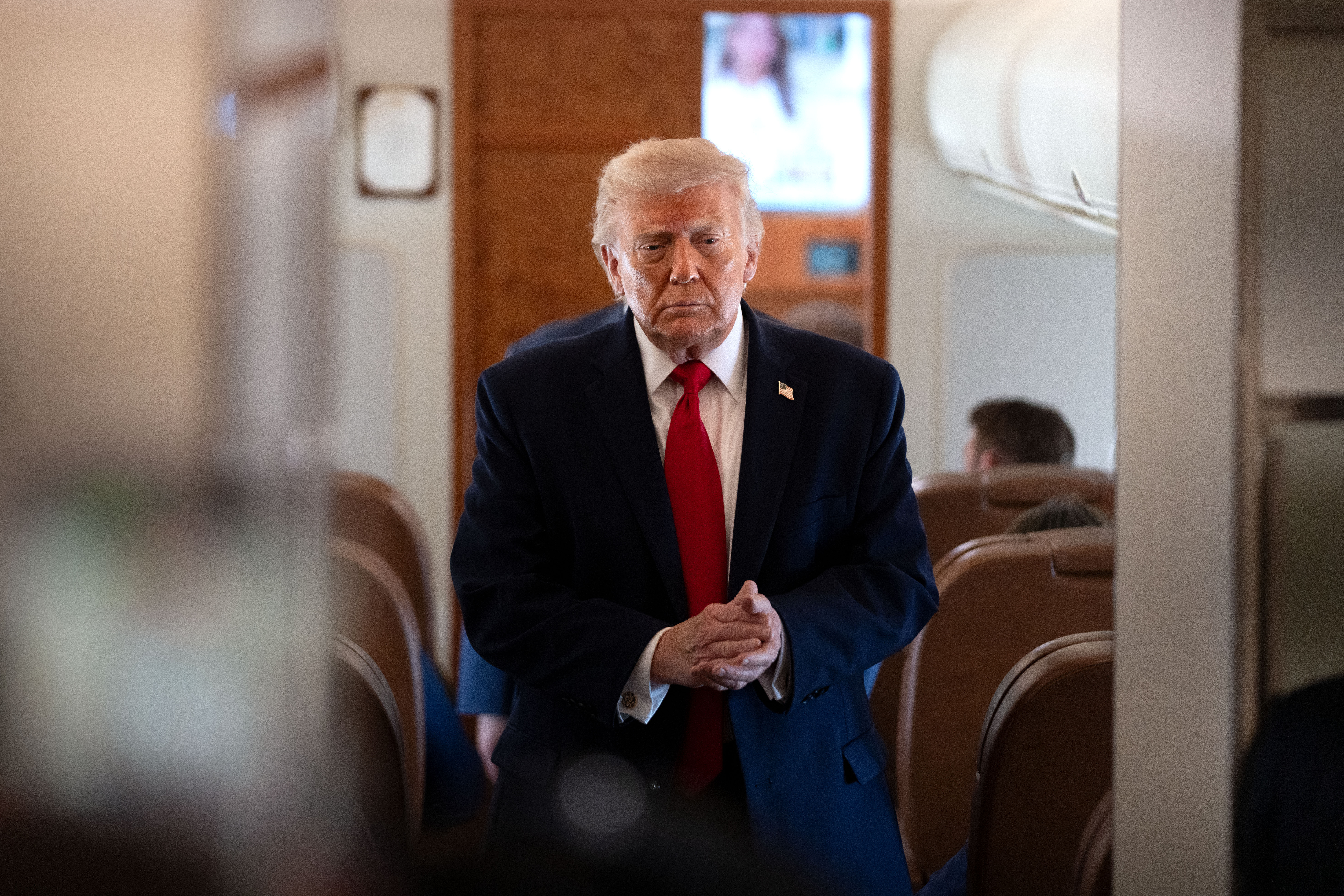 President Donald Trump aboard Air Force One on Friday, en route to Eau Claire, Wisconsin, from Joint Base Andrews in Maryland. (Mark Schiefelbein/AP)