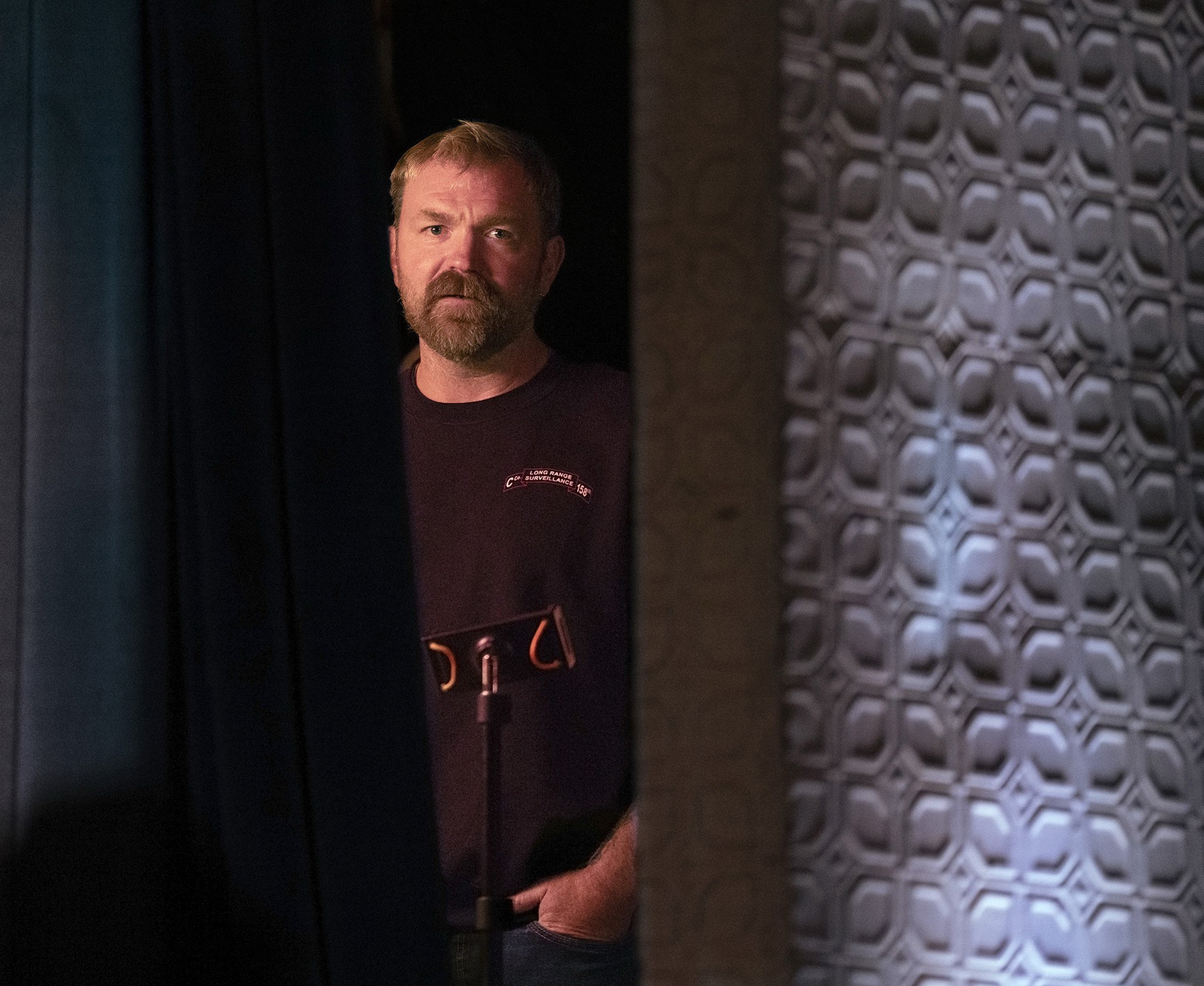 Democratic U.S. Senate candidate Graham Platner stands backstage at a town hall event in Oguquit, Maine, in October. (Gregory Rec/Portland Press Herald/Getty Images)