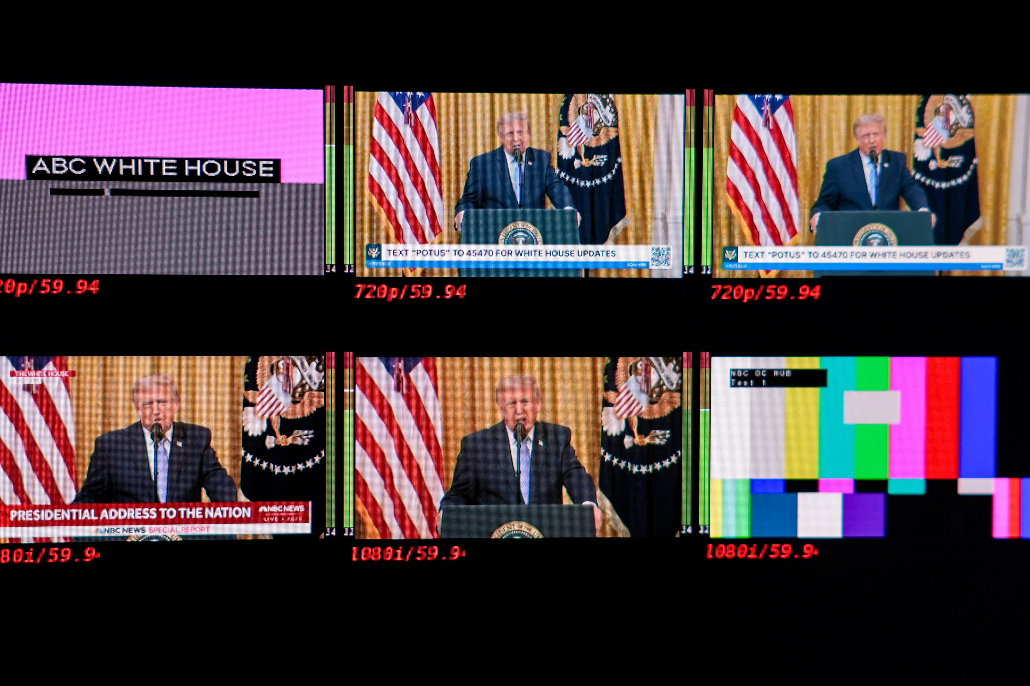 Screens inside the White House press briefing room display the president during the speech. (Kylie Cooper/Reuters)