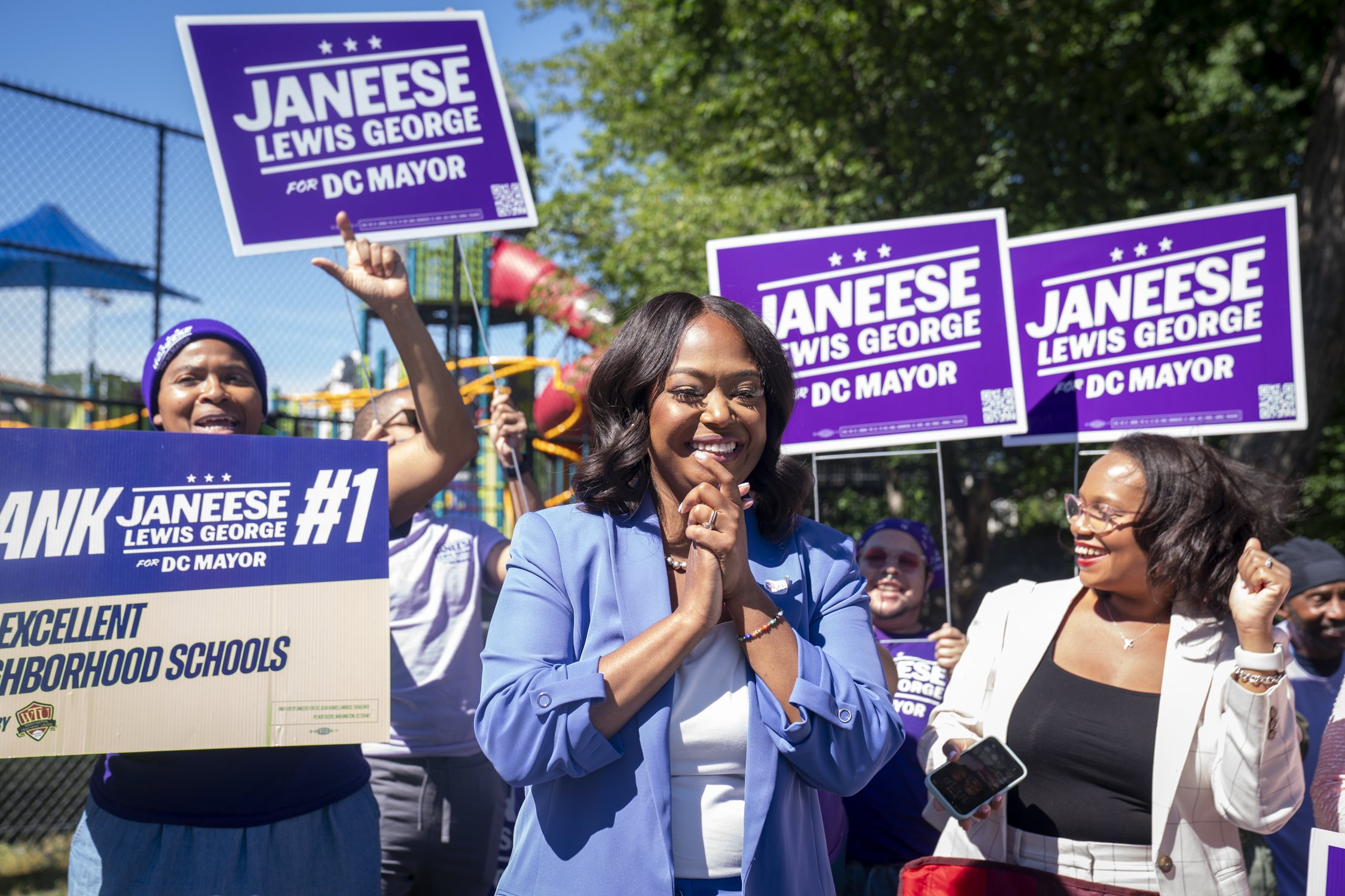 Mayoral candidate Janeese Lewis George meets with campaign volunteers outside of the Benning Stoddert Recreation Center voting station in Southeast Washington on Tuesday, the day of D.C.'s primary election. (Maxine Wallace/The Washington Post)