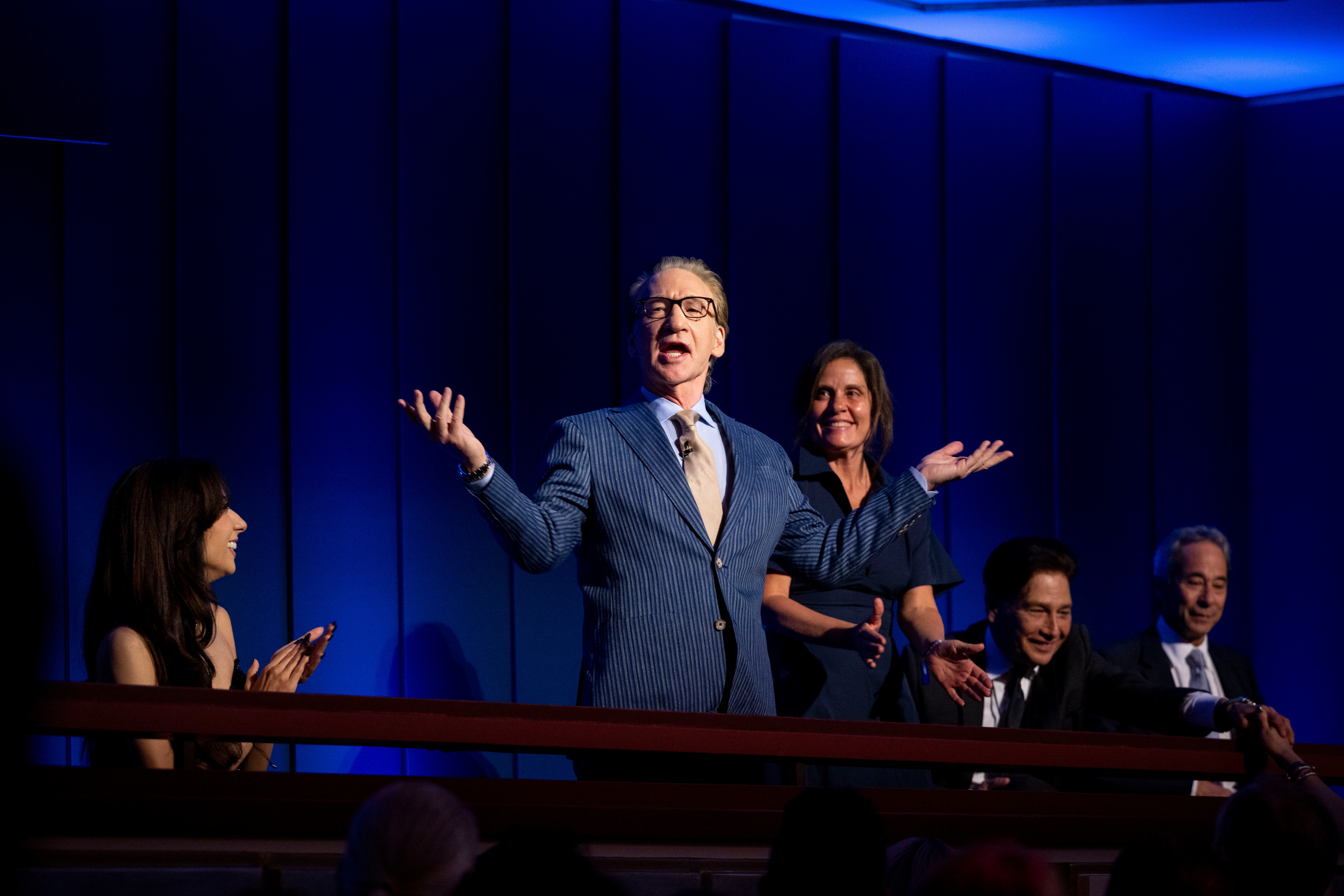 Comedian Bill Maher greets the audience at the start of the Mark Twain Prize for American Humor on Sunday. (Kevin Wolf/AP Photo/Kevin Wolf)