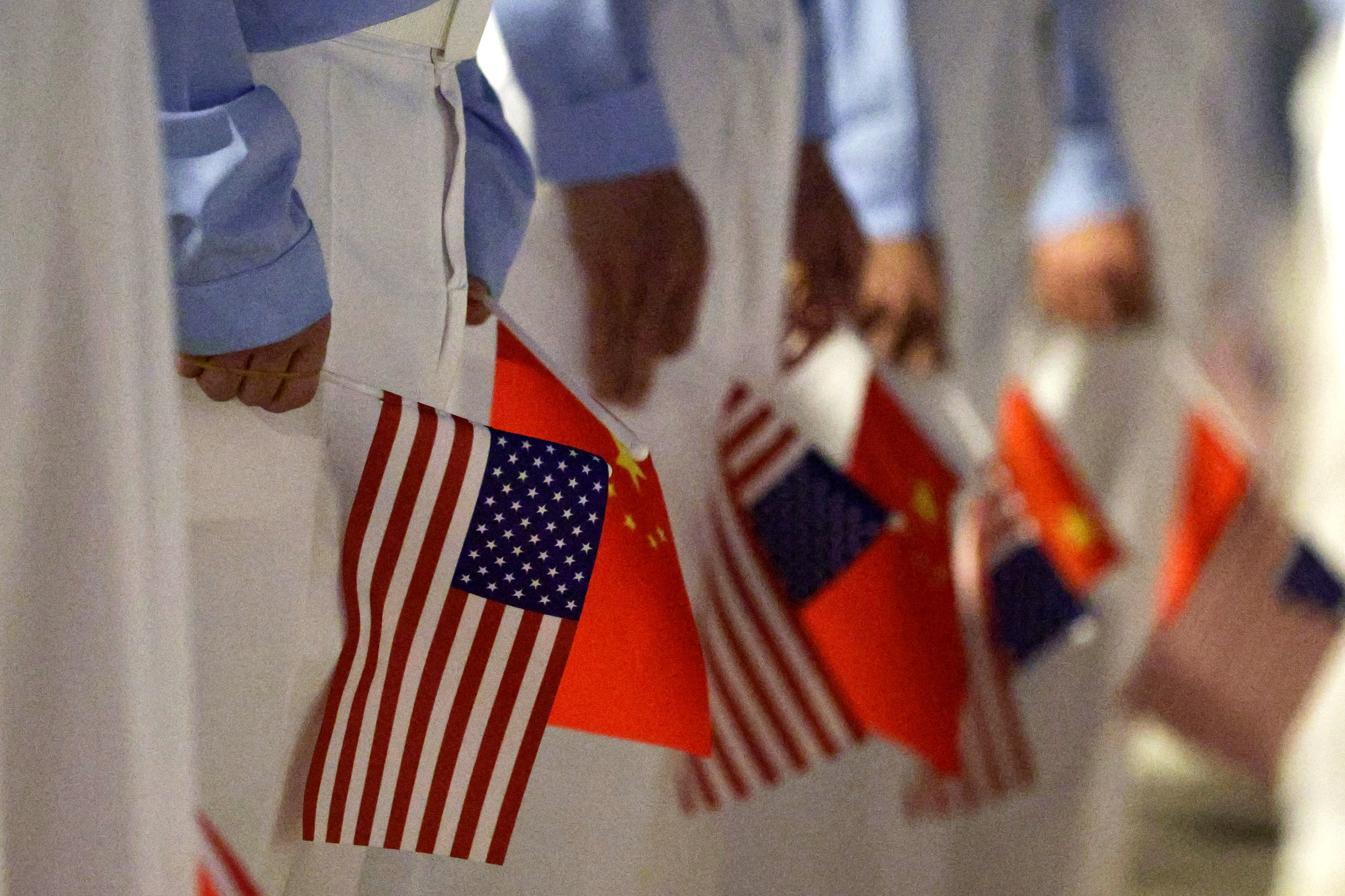 Children display American and Chinese flags as part of the official welcome ceremony for President Donald Trump in Beijing on Wednesday. (Alex Wong/Getty Images)