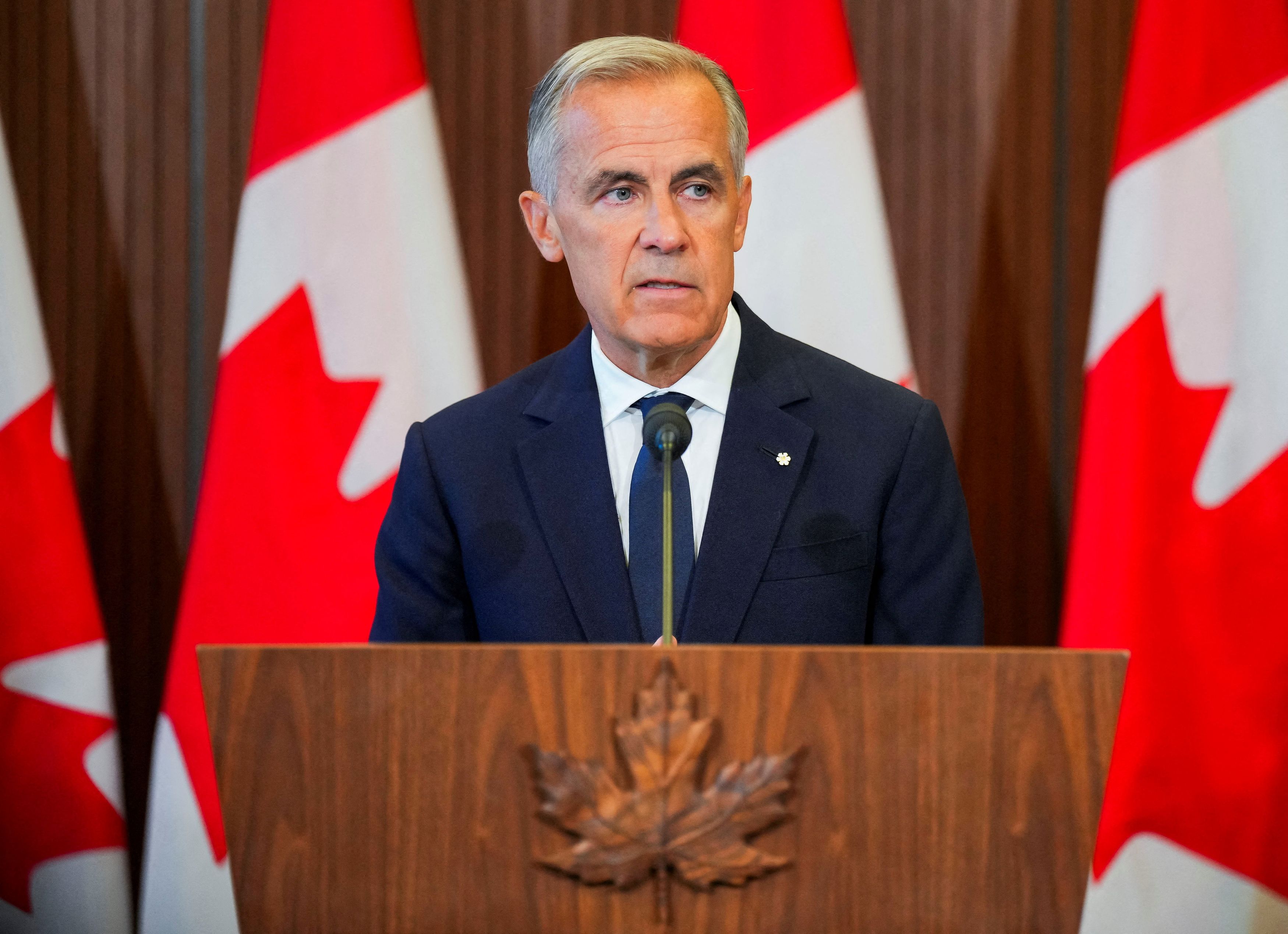 Canadian Prime Minister Mark Carney speaks to the news media after trade negotiations with the United States were suspended. (Chris Tanouye/Reuters)