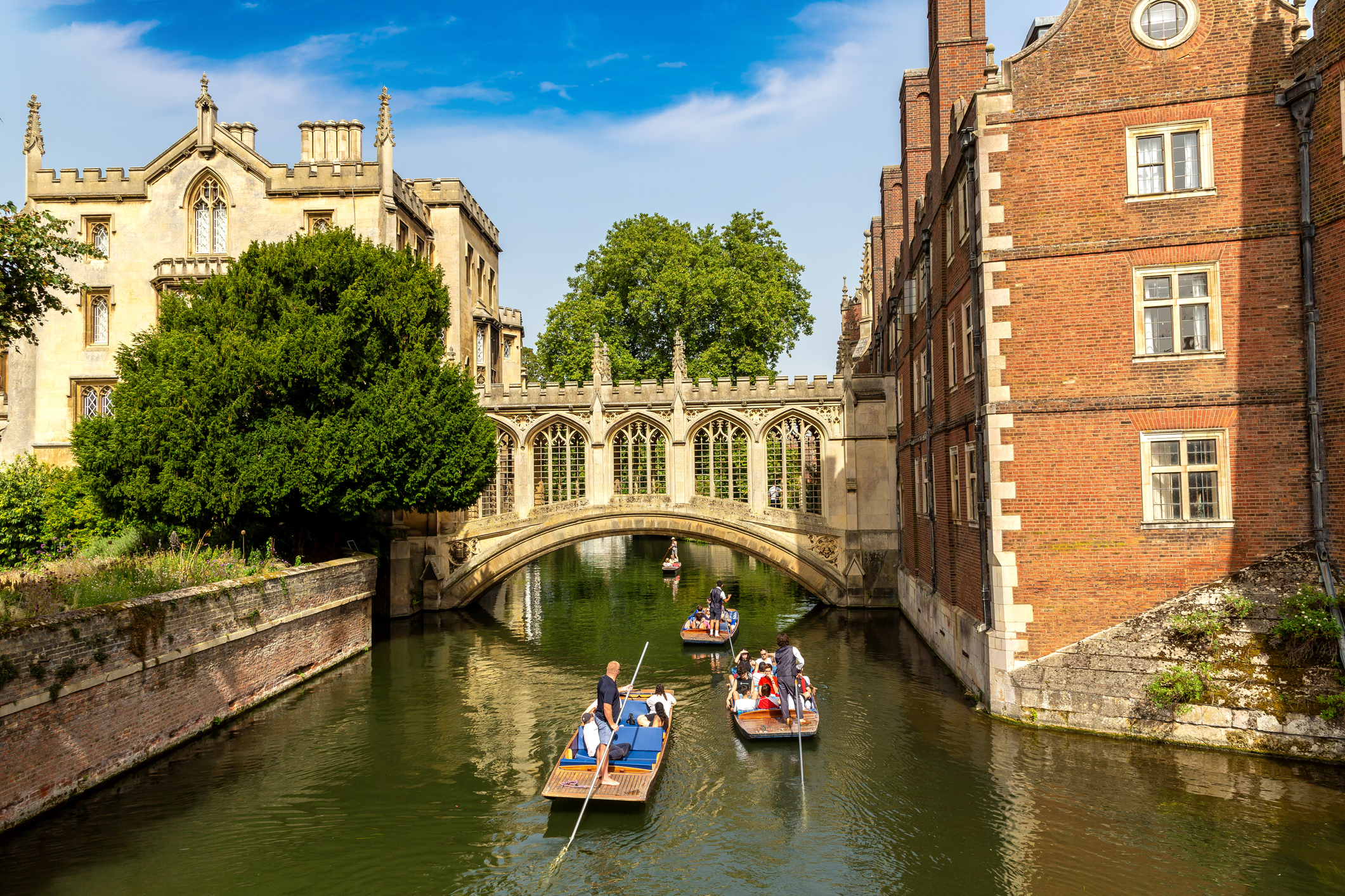 Punting boat tours in Cambridge travel the river, which borders lovely gardens. (iStock)