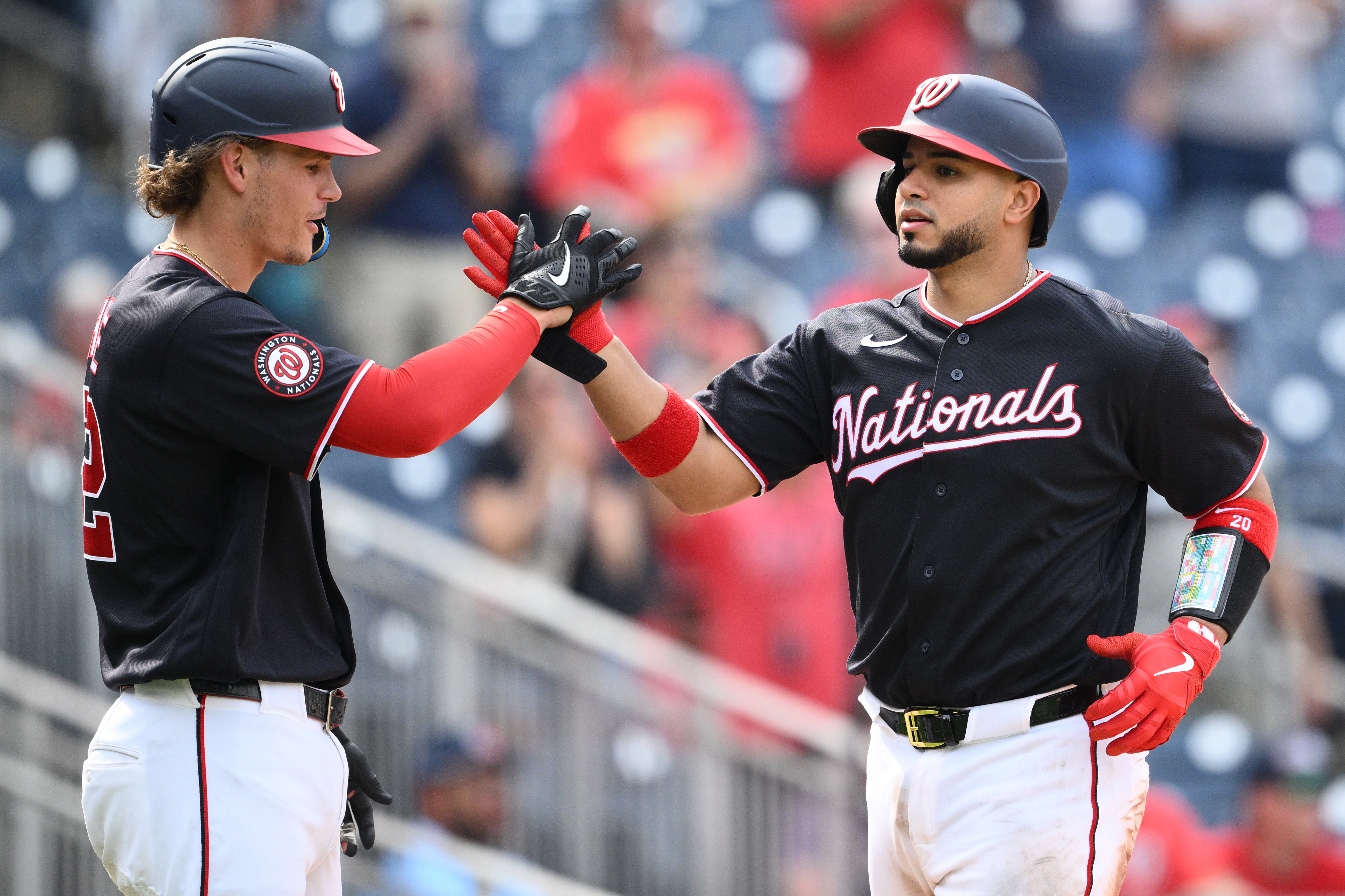Keibert Ruiz, right, is greeted by Brady House after wrapping up the scoring with a two-run home run in the eighth inning. (Nick Wass/AP)