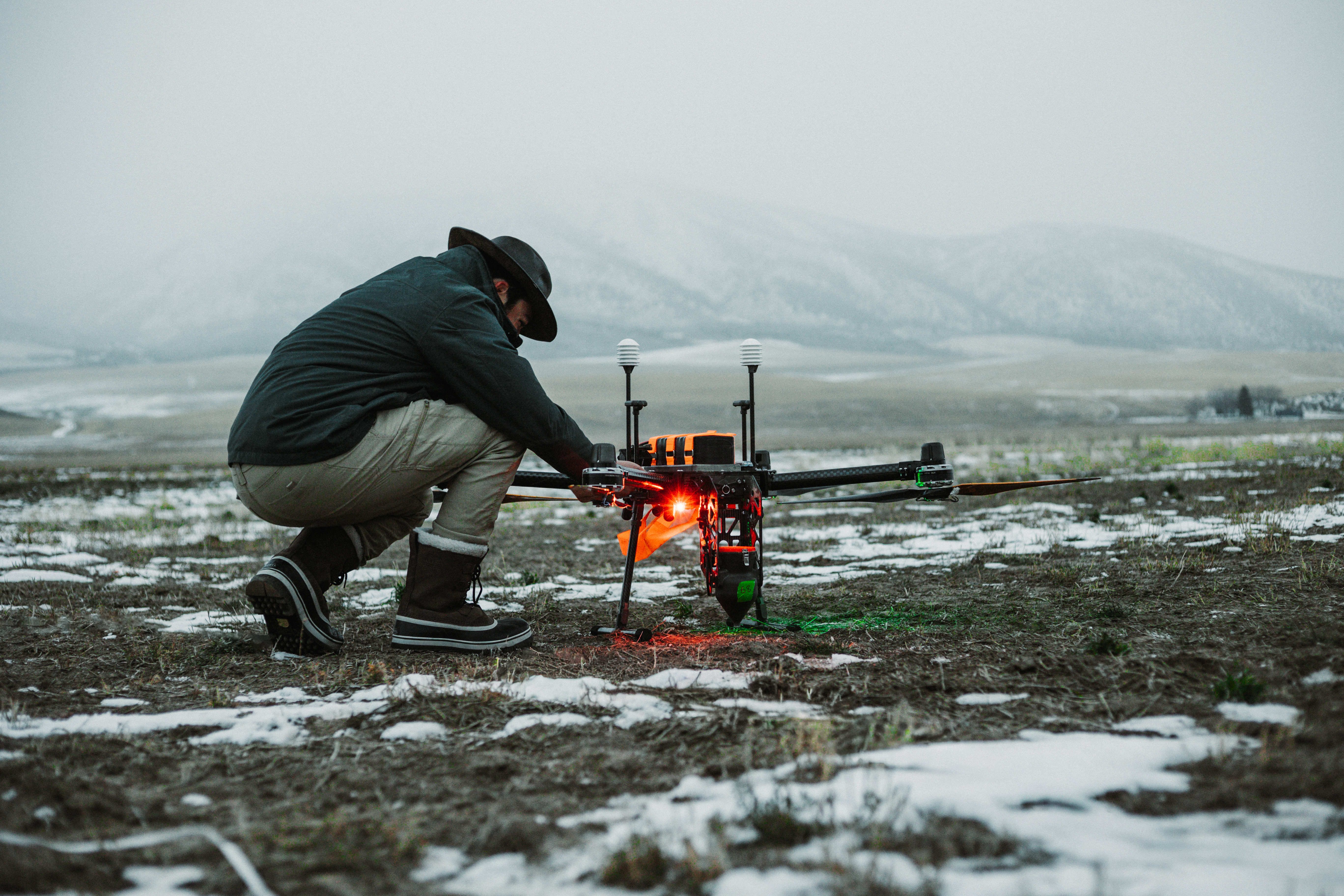 A Rainmaker forward operating specialist performs a preflight check on the Elijah UAV outside Pocatello, Idaho. (Photo by Nico Abegg-Guzman)