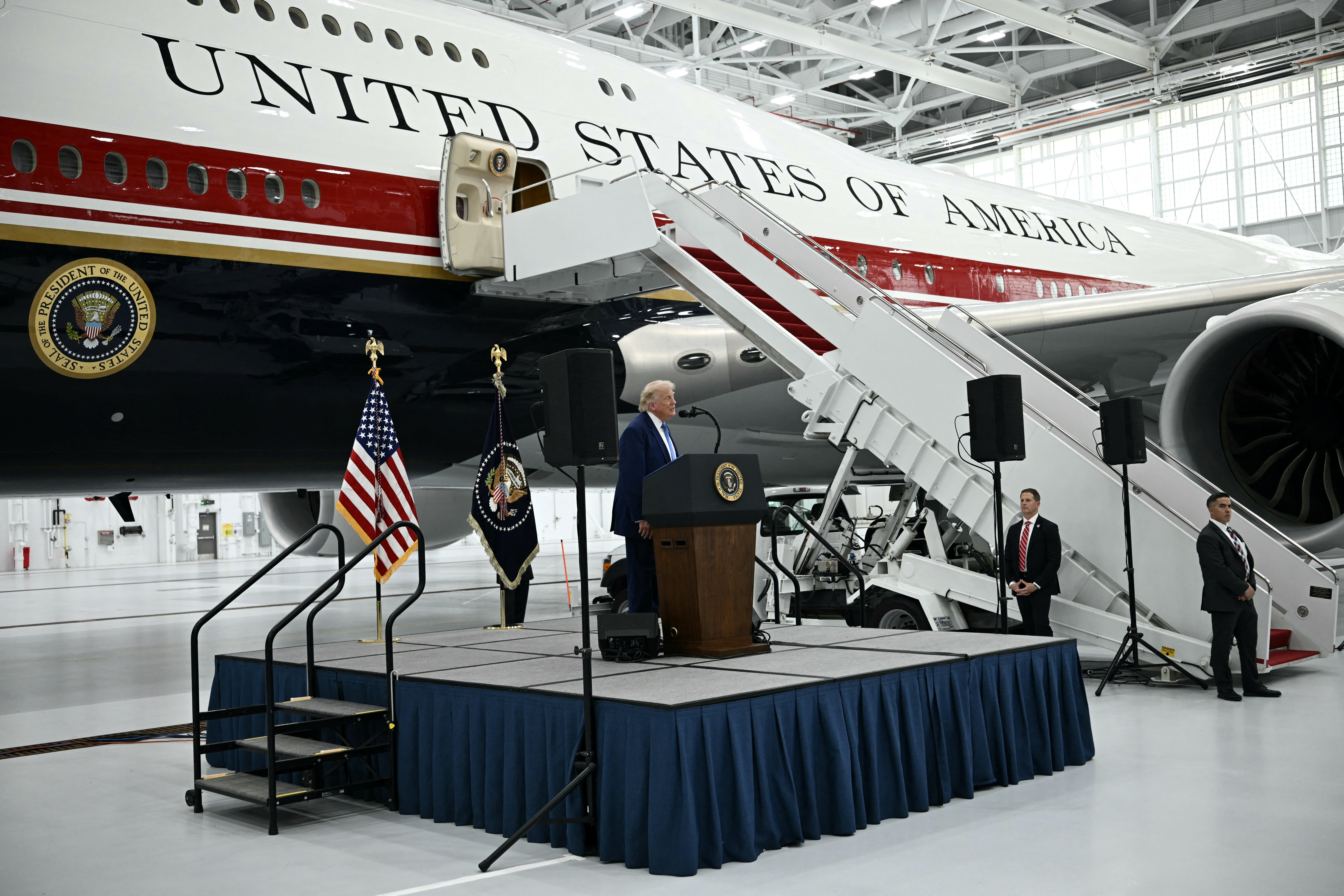 President Donald Trump speaks in front of the new Air Force One, gifted to him by Qatar, last month in a hangar at Joint Base Andrews in Maryland. (Brendan Smialowski/AFP/Getty Images)
