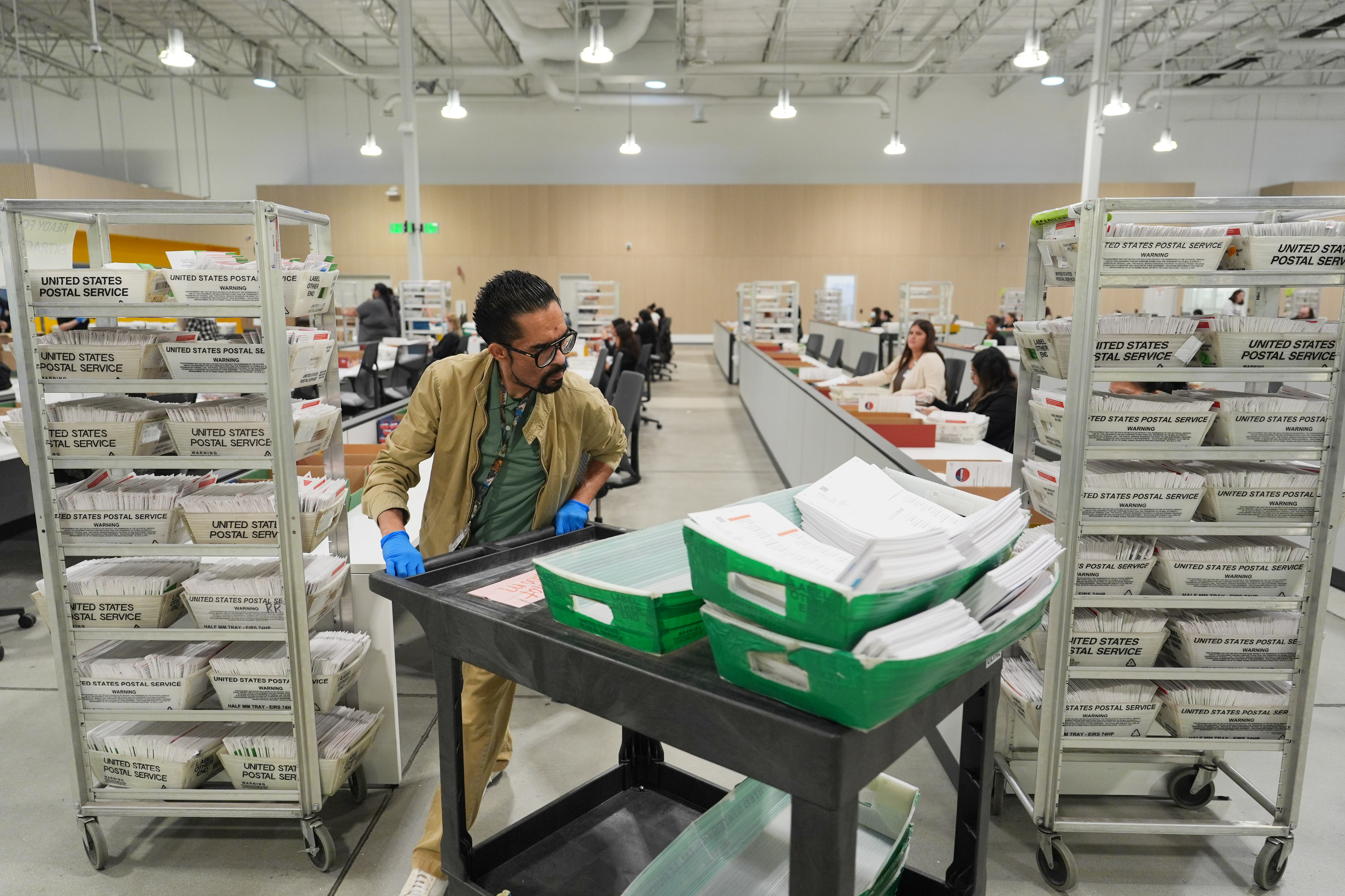 Ballots are sorted in Los Angeles County the day after California's primary elections in June. (Jae C. Hong/AP)