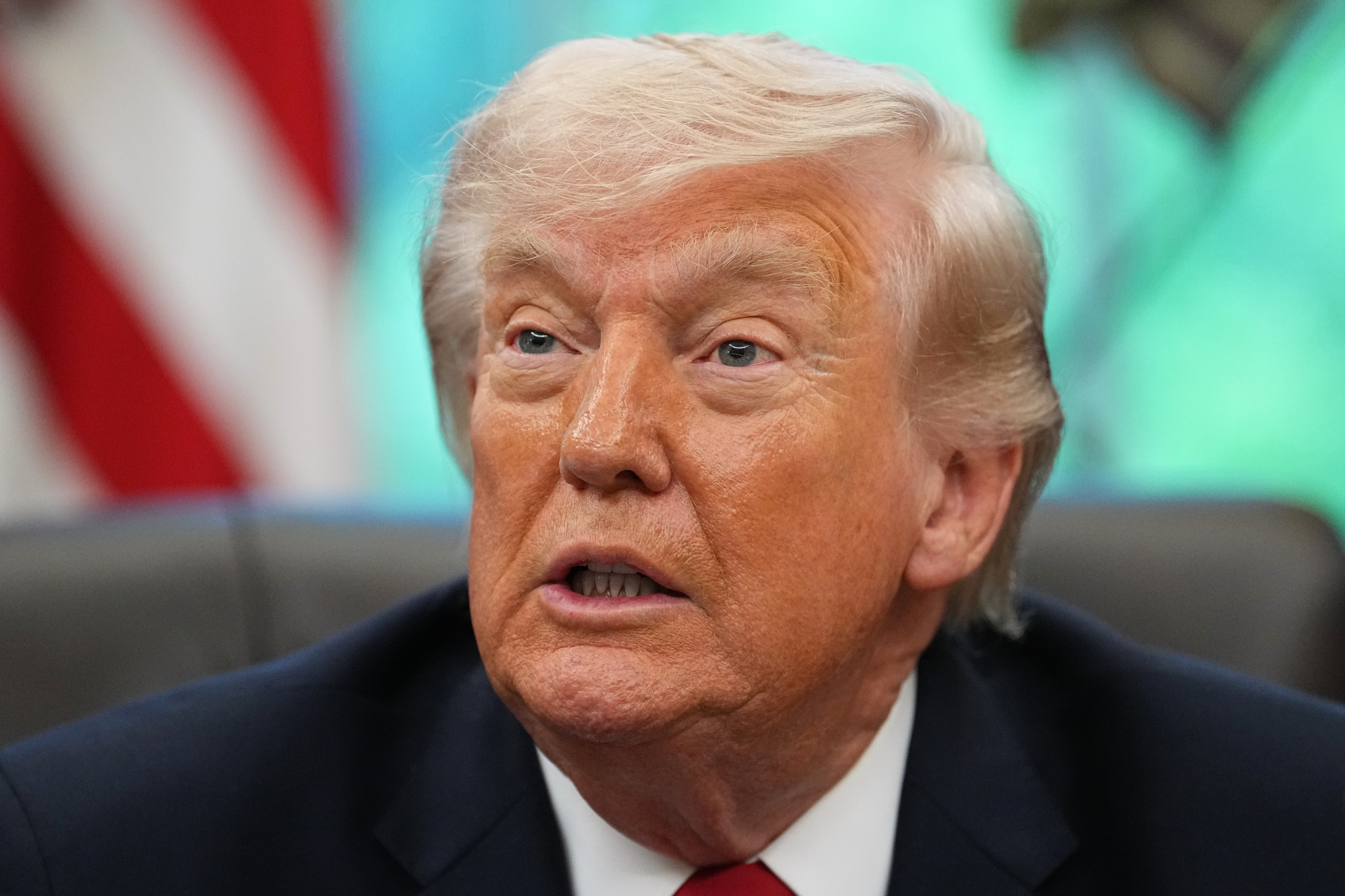 President Donald Trump speaks to reporters Wednesday at the White House. (Matt Rourke/AP)