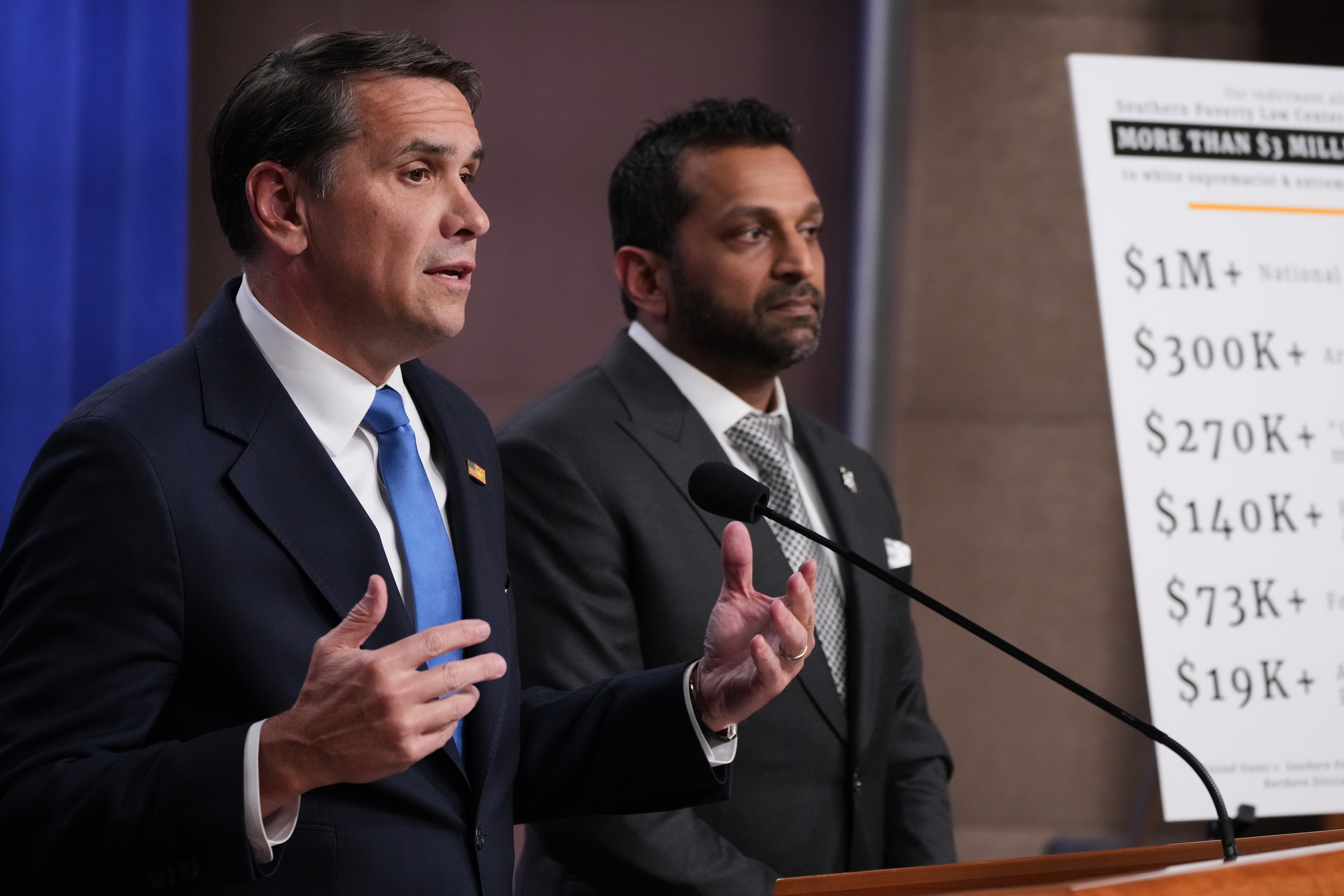 Acting attorney general Todd Blanche speaks as FBI Director Kash Patel listens during a news conference at the Justice Department last month. (Jacquelyn Martin/AP)