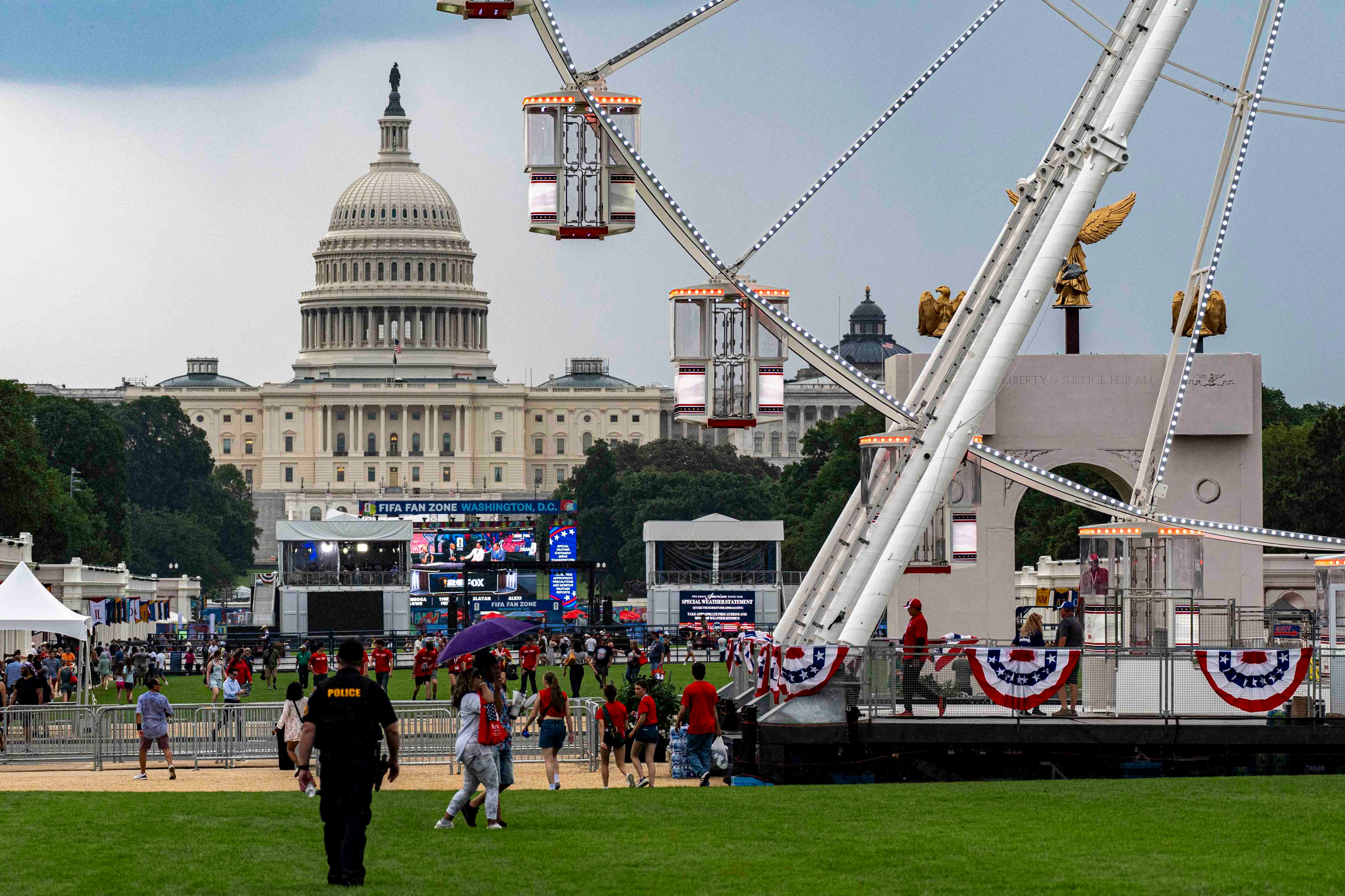 The Freedom 250 Ferris Wheel and the U.S. Capitol are seen June 26 during the fair. (Jen Golbeck/AP)