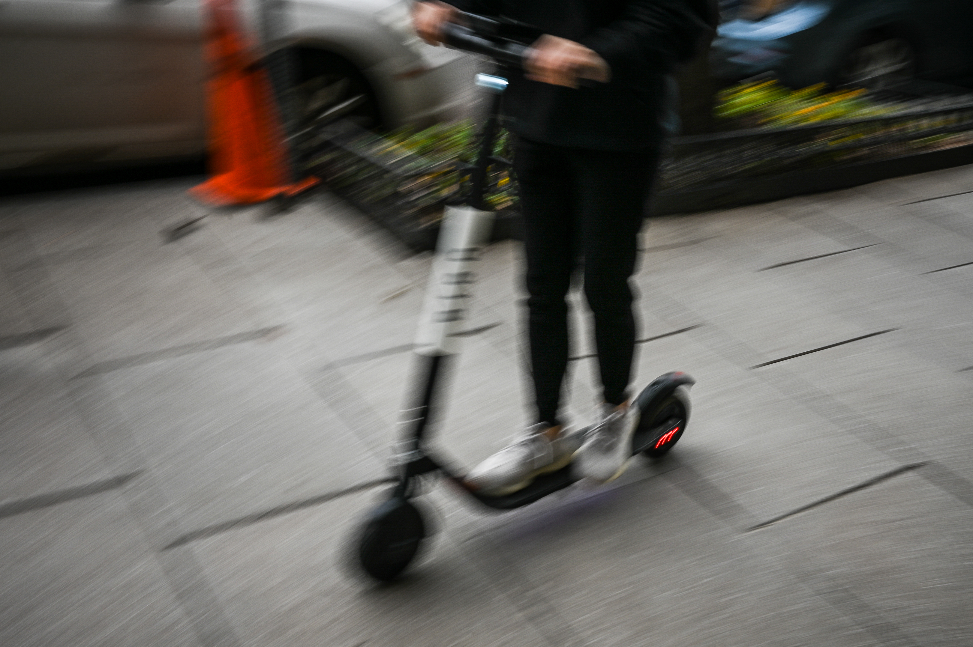 Riding an electric scooter along K Street NW in Washington in 2019. As e-scooters become more popular, doctors say they’ve seen a sharp increase in injuries, including among children. (Salwan Georges/The Washington Post)