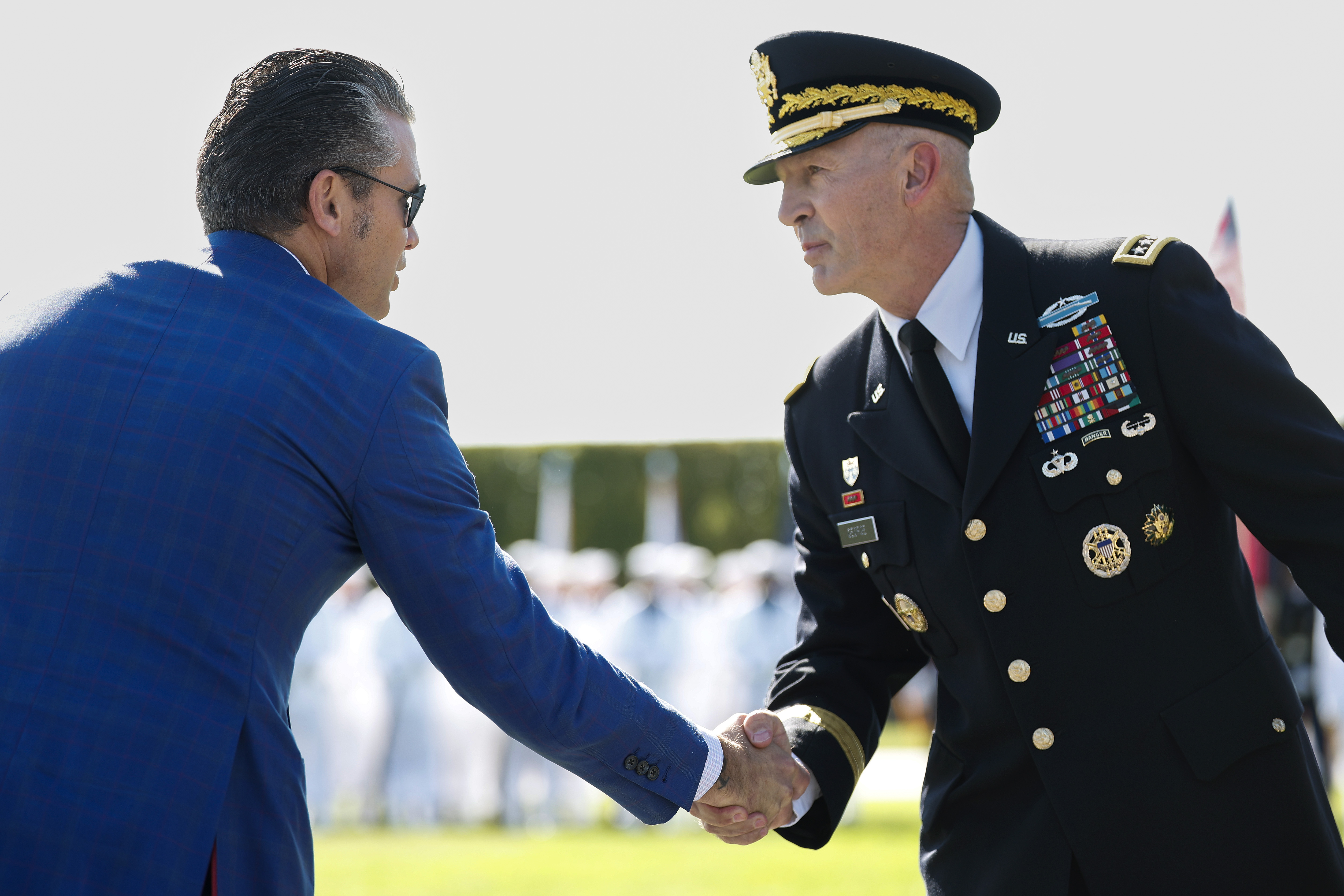 Defense Secretary Pete Hegseth greets Gen. Randy George, then the Army's chief of staff, during a ceremony in September 2025. (Kevin Dietsch/Getty Images)
