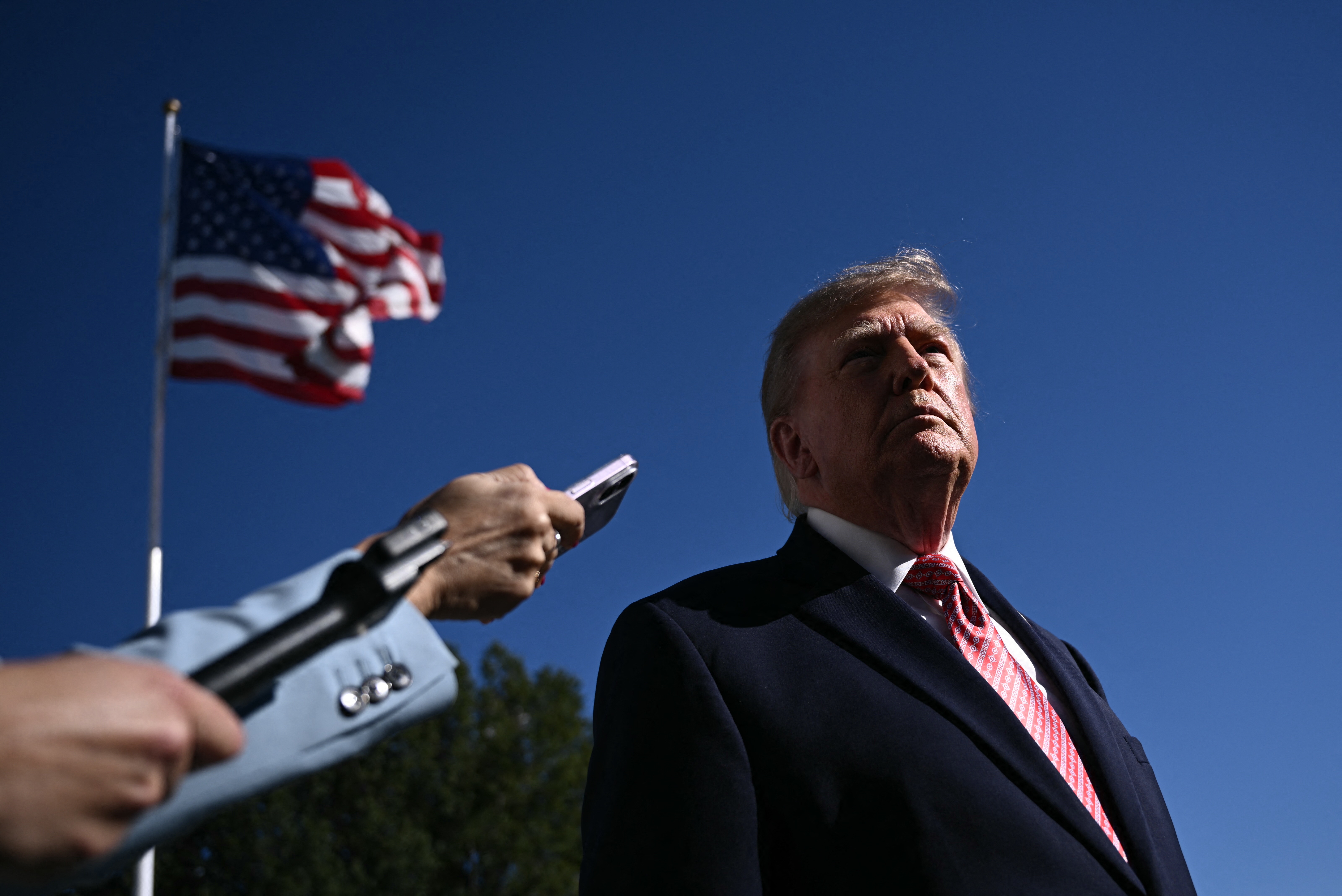 President Donald Trump takes questions from the news media before departing the White House for a political rally in Kansas on Monday. (Brendan Smialowski/AFP/Getty Images)