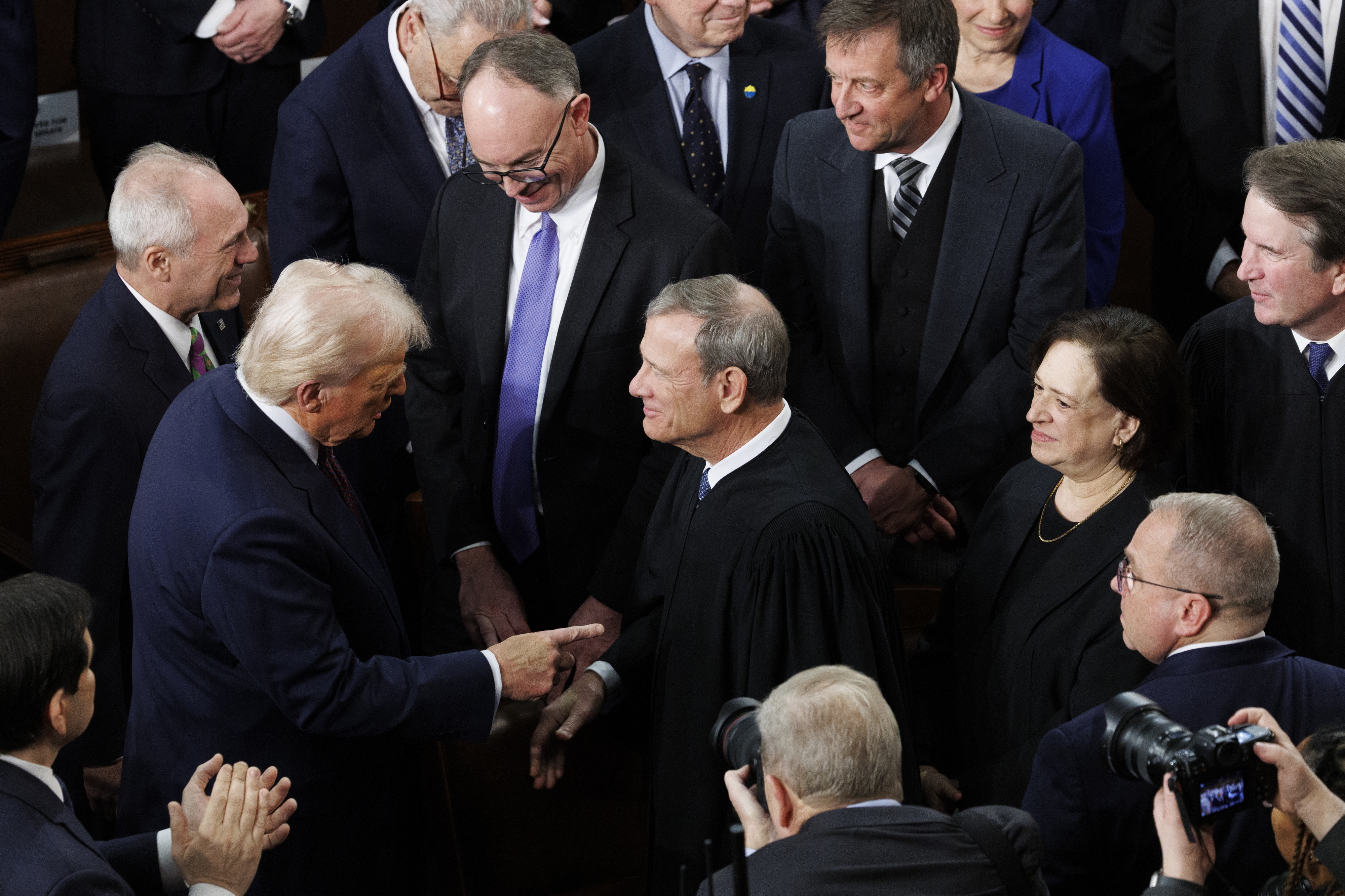 President Donald Trump greets Chief Justice John G. Roberts Jr. during a joint session of Congress on March 4, 2025. (Tom Brenner/For The Washington Post)