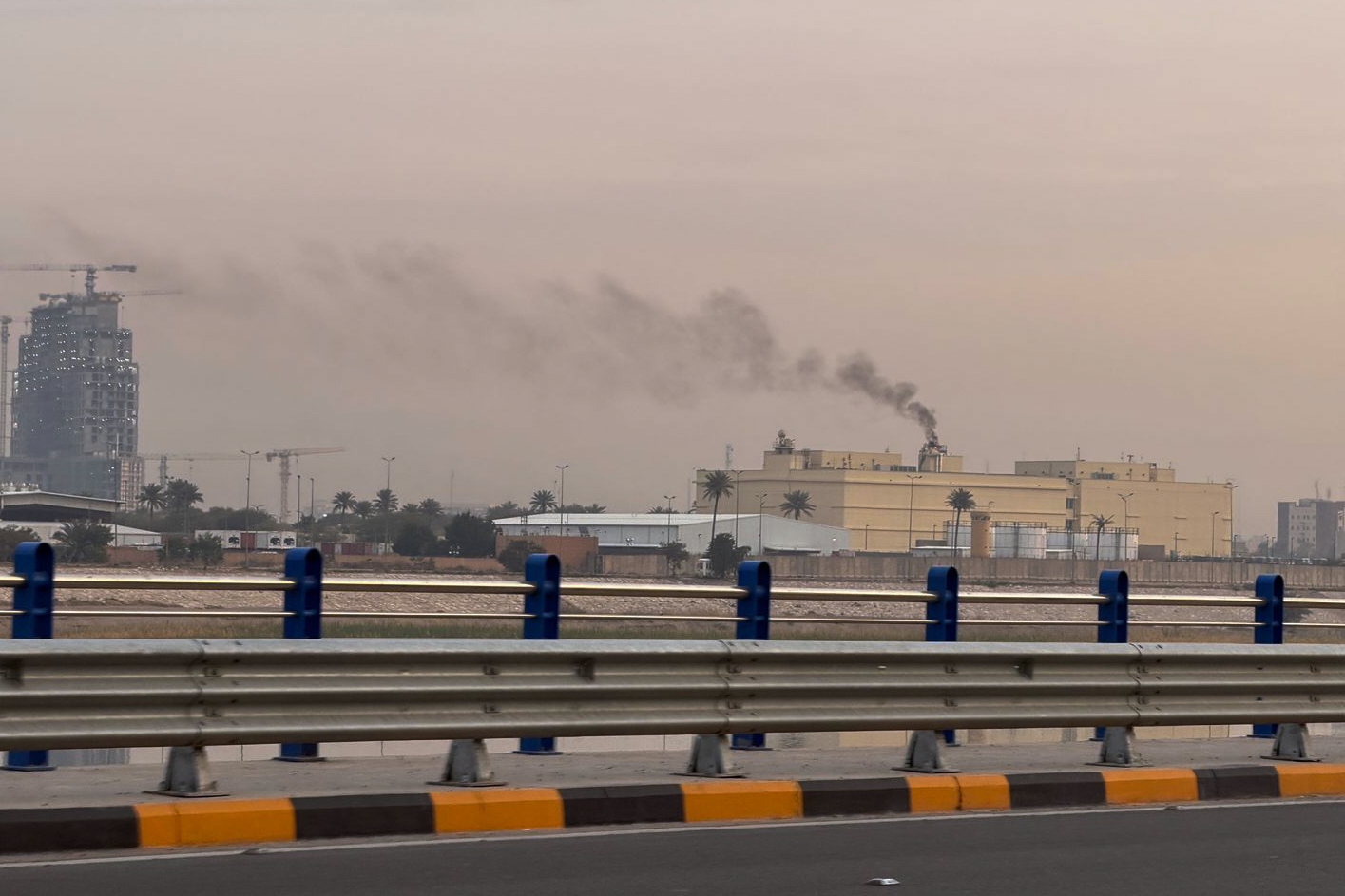 Smoke rises from the U.S. Embassy in Baghdad on Saturday. (Ali Jabar/AP)